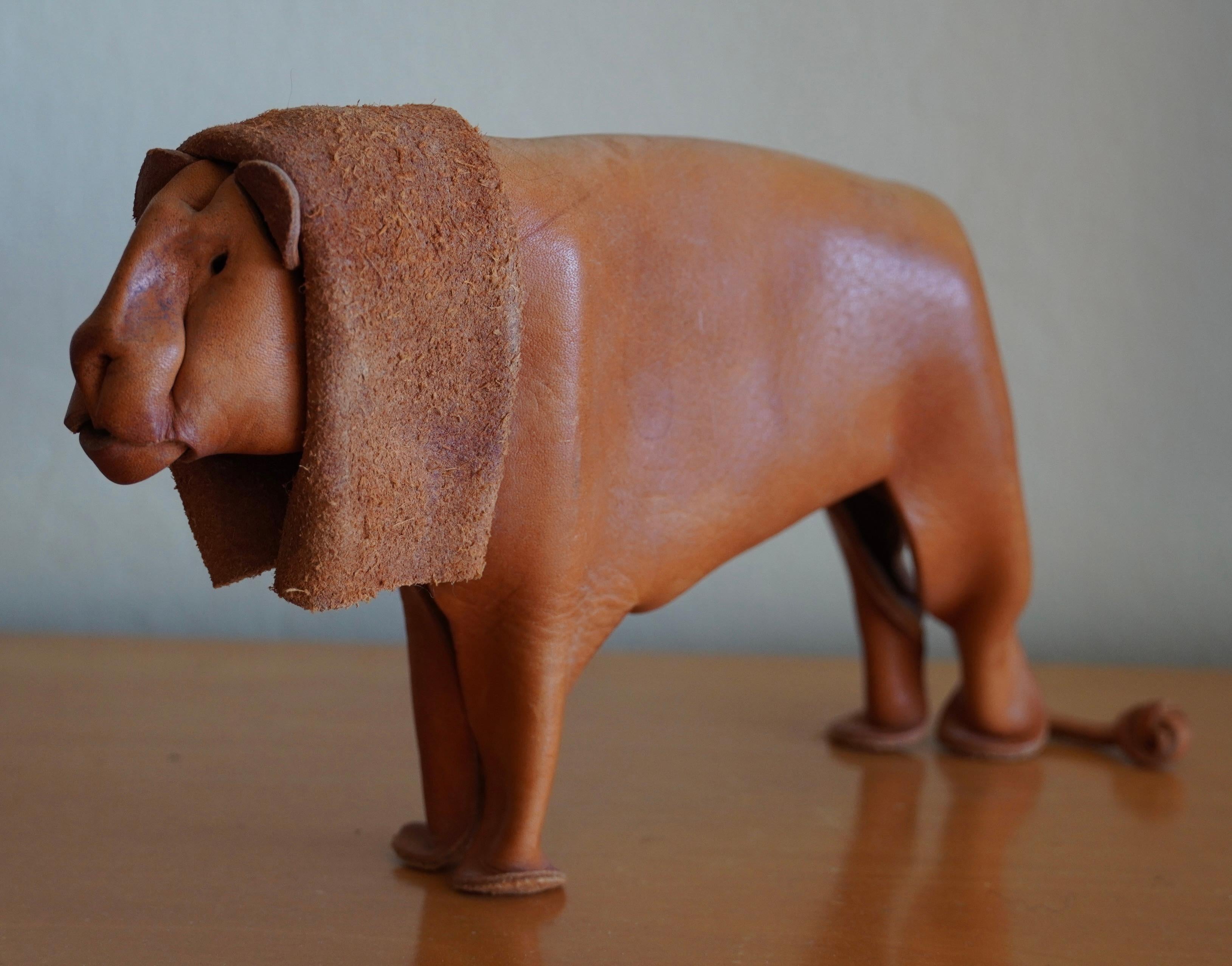 Hand crafted lion in leather by Deru of Germany circa 1960s, the leather is hand sculpted using a series of folds, riveting and molding of the leather. A very unique process using this medium.