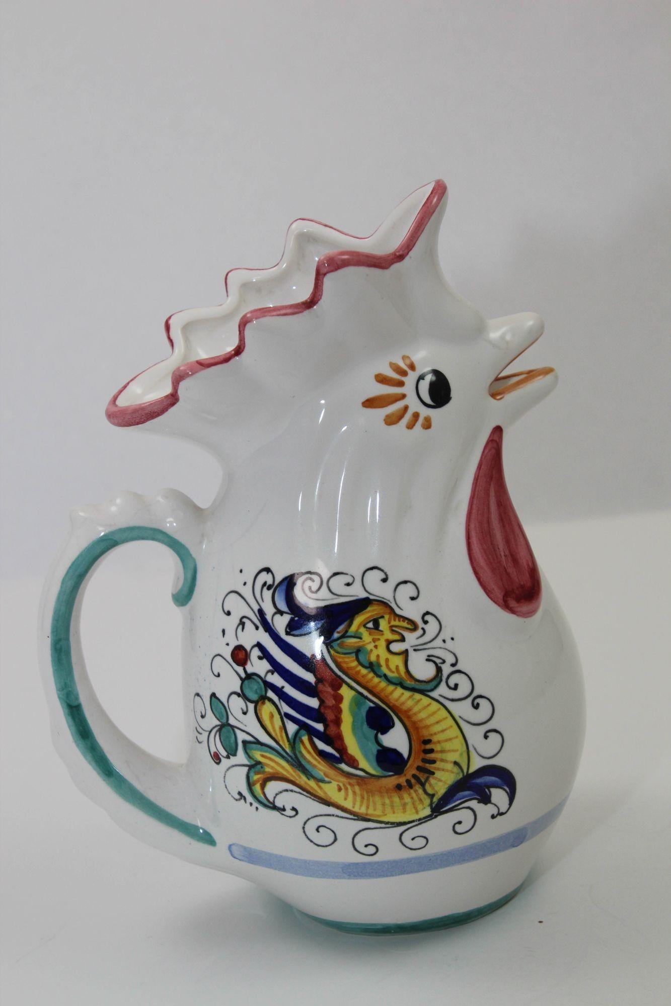 Deruta Italian Lucky Rooster Chicken Ceramic Pitcher Hand Painted and Signed.
Fun and colorful vintage authentic Italian lucky rooster chicken pottery pitcher.
Figural Pitcher by DERUTA Italy.
One of kind hand painted and hand made in Italy.
Perfect