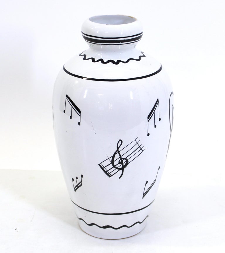 Deruta Italian Mid-Century Modern ceramic vase with musical notes and stylized musicians, marked 'Deruta Italy' on the bottom.