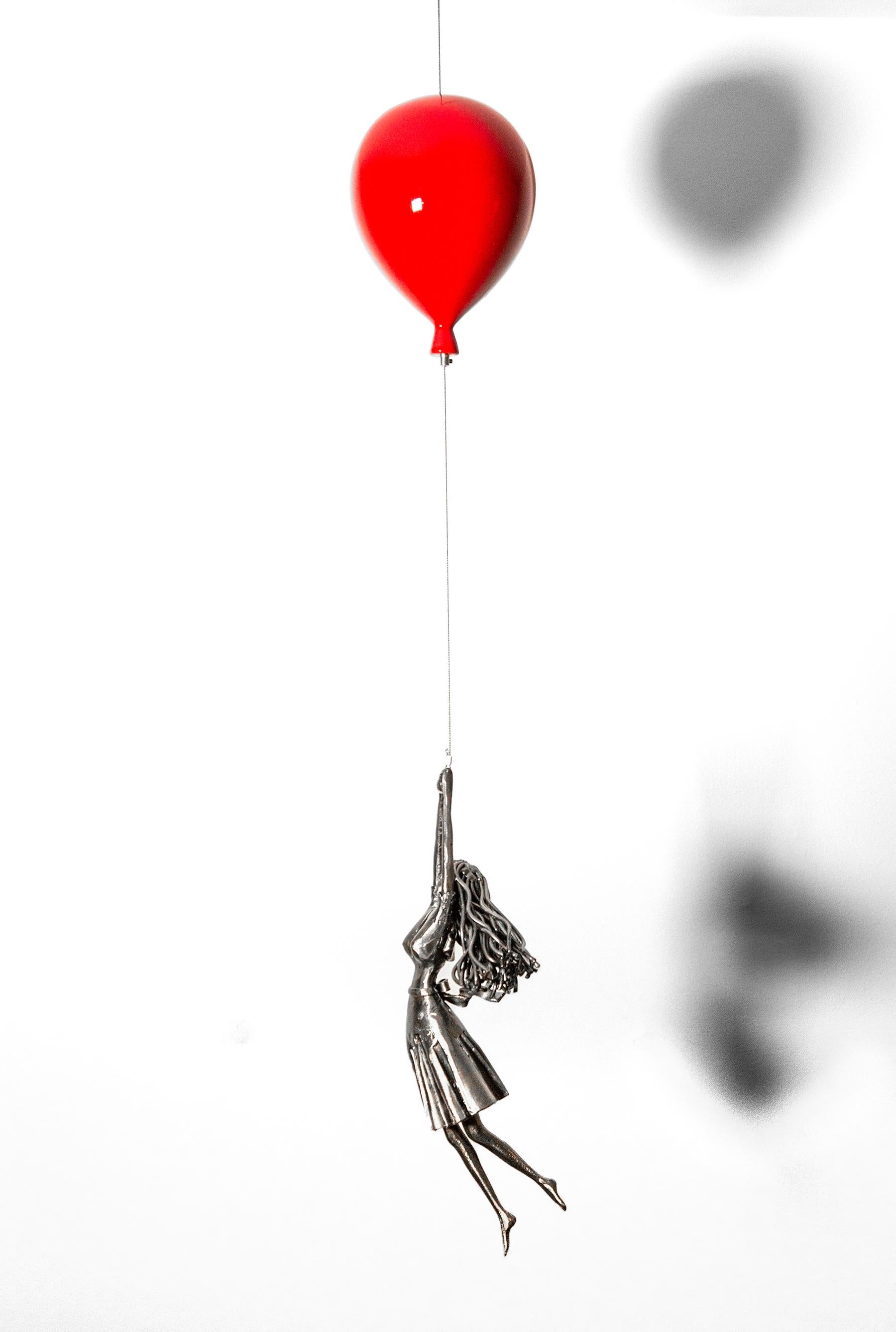 hand letting go of balloon