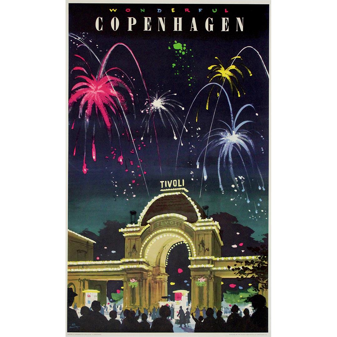 1958 original travel poster by Des Asmussen Wonderful Copenhagen – Tivoli. This striking mid-century poster captures the festive spirit of Copenhagen’s famous Tivoli Gardens with fireworks exploding in vivid reds, yellows, pinks, and whites above
