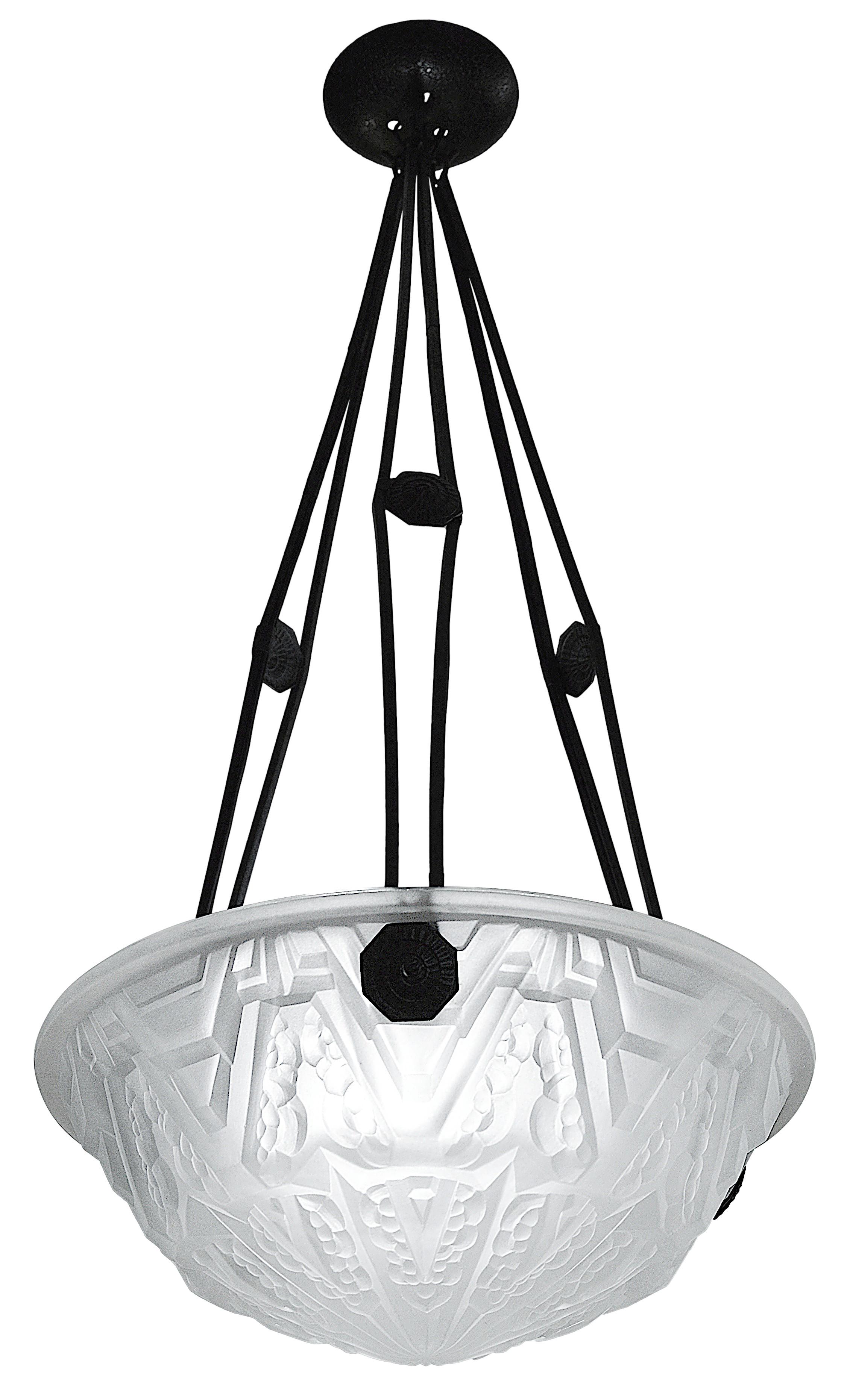 French Art Deco pendant chandelier by Verrerie des Hanots (Les Andelys), France, ca.1925. Thick opalescent molded glass. White glass very slightly tinted yellow. Wrought-iron fixture. Measures: height: 30.7