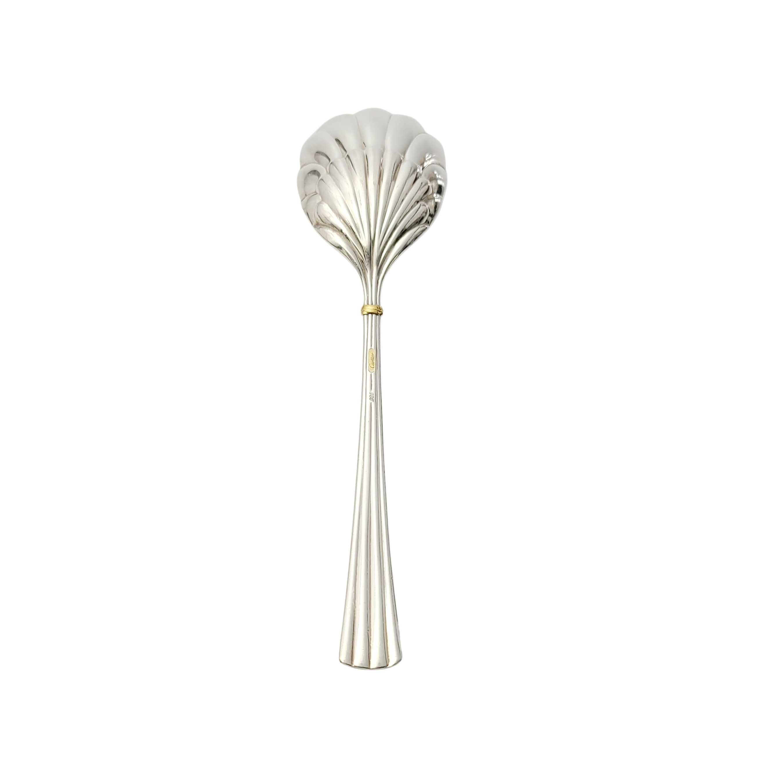 Vintage sterling silver sugar shell bowl sugar spoon by Cartier.

No monogram.

Cartier's Des Must pattern features a simple and timeless rubbed design with a small gold accent. Shell bowl.

Measures 6 1/4