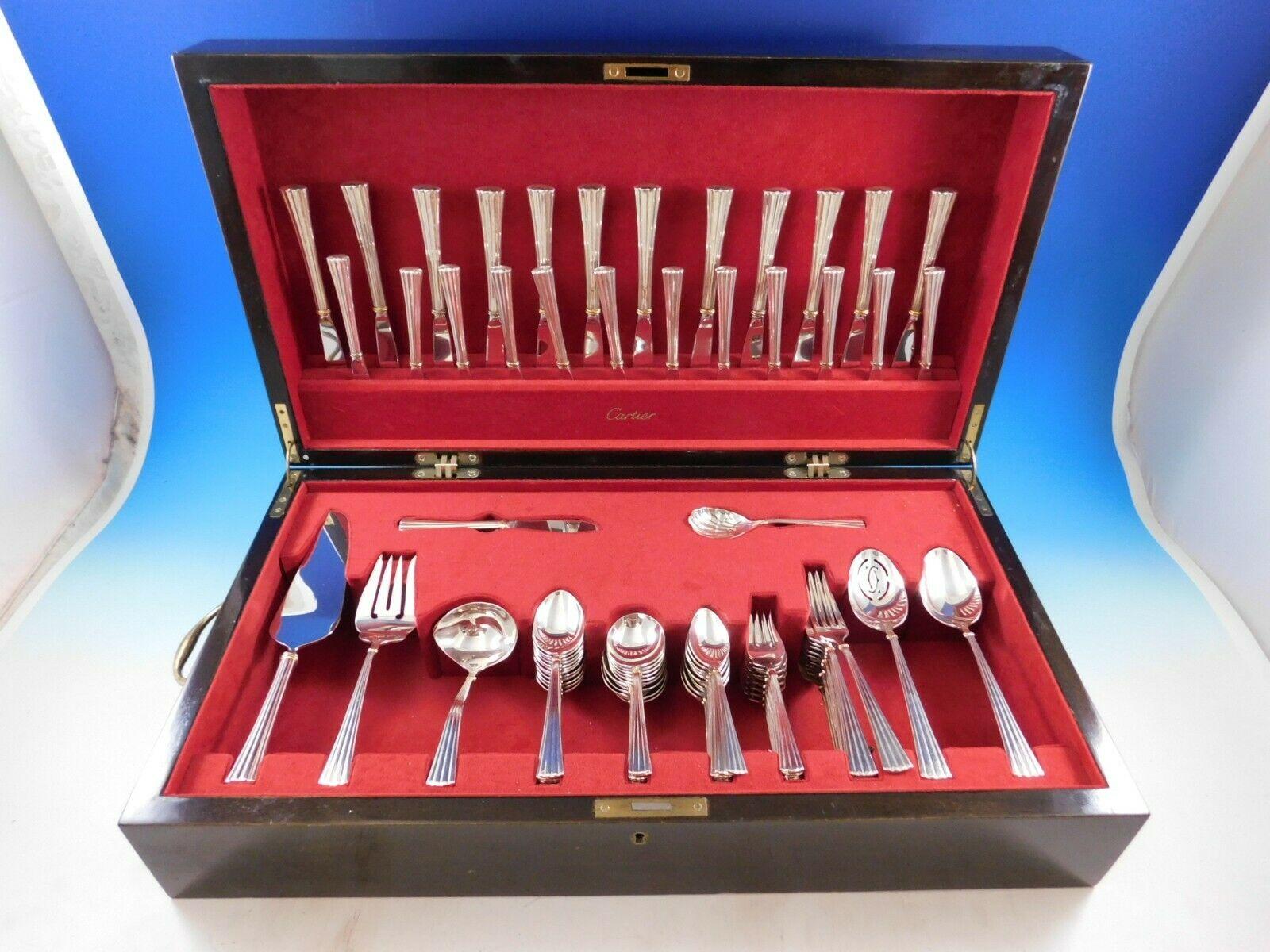 Superb Des Must Gold Accent by Cartier sterling silver Flatware set in fitted Cartier chest, 91 pieces. This set includes:

12 Dinner Knives, 9 1/2