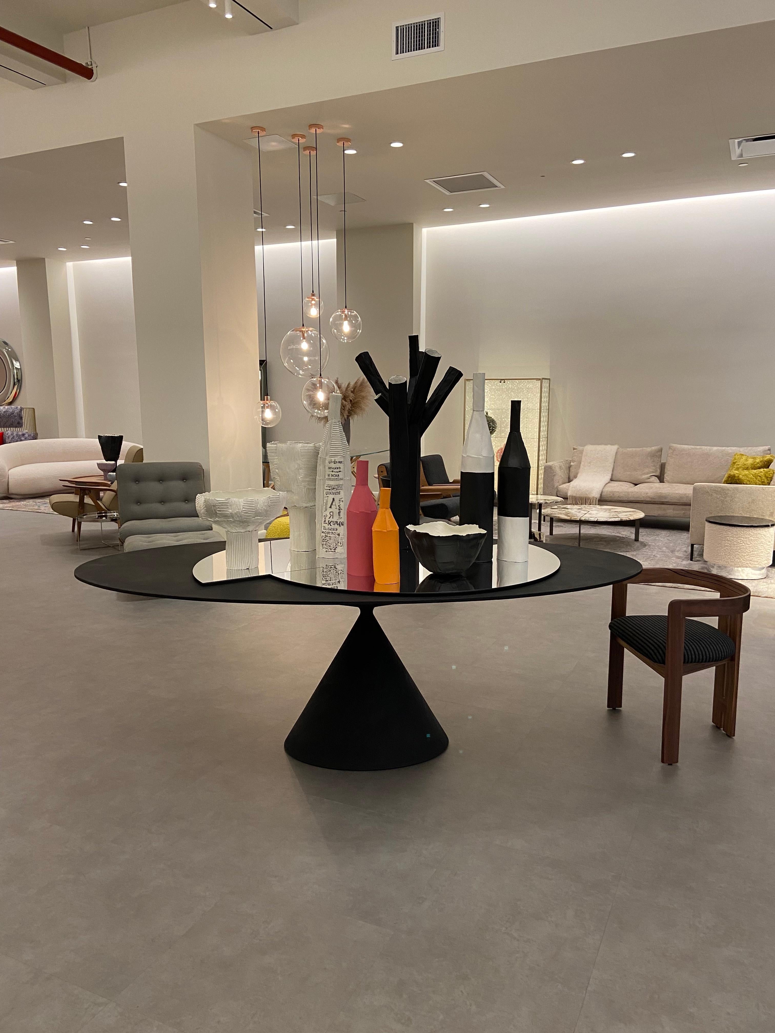 Stock 218 x 120cm oval table in D67 lava stone.
Floor sample
Table with rigid polyurethane base and MDF top, completely covered with hand-spread paste. Table height 75,5 cm.

More than a table, a sculpture, a perfect union of beauty and