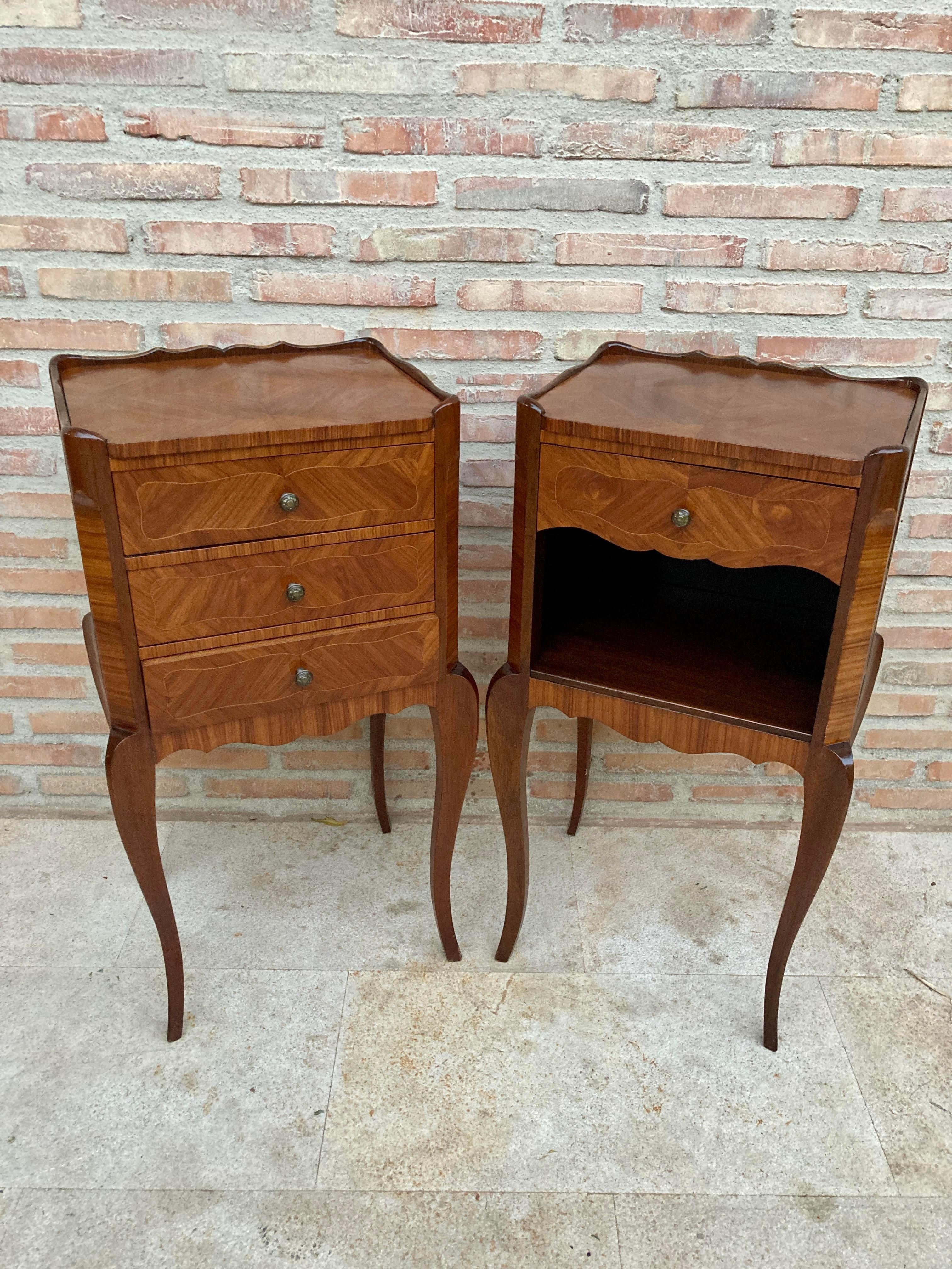 Matching Kingwood Louis XV style nightstands, distinguished from each other in that one has three drawers and the other has one drawer and one open shelf, with marquetry on top, sides and front. The pieces retain their original beautiful marquetry
