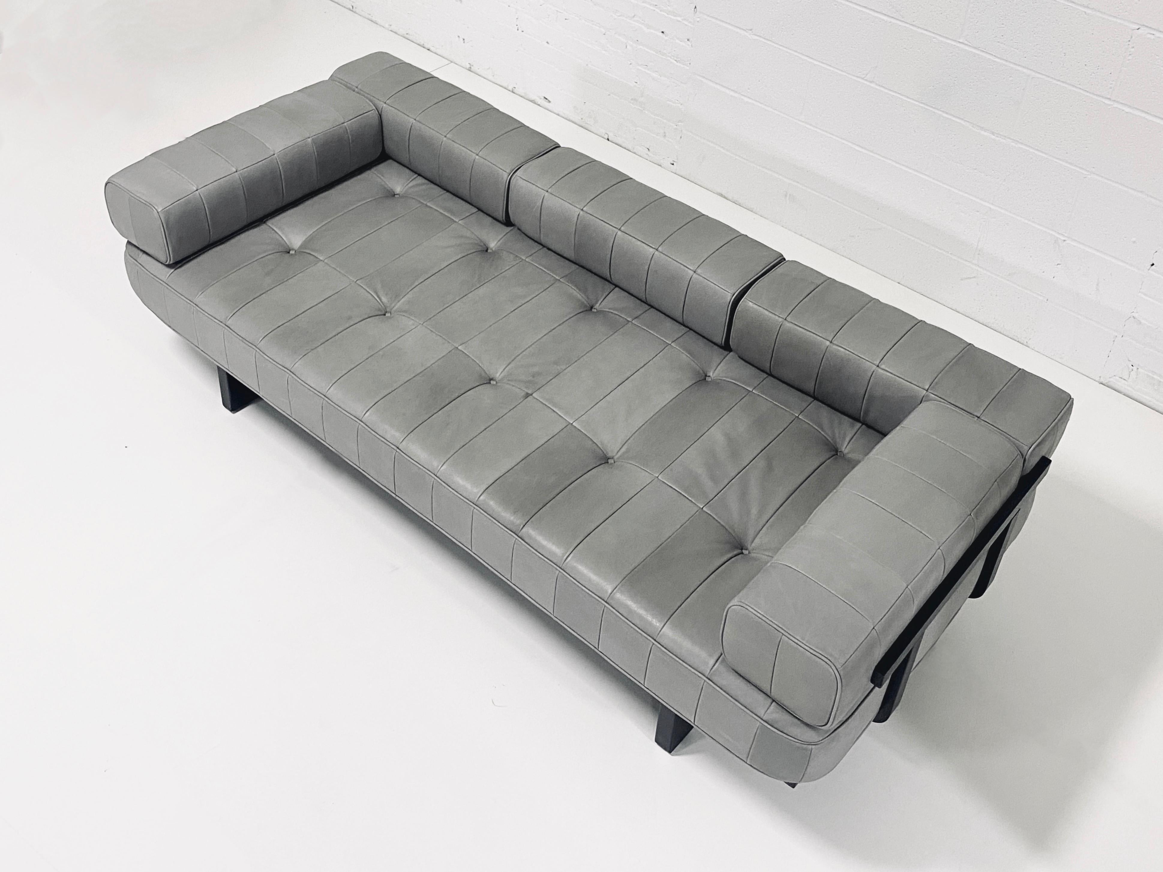 Leather patchwork sofa by De Sede. Model DS. 80. Back and arm brackets can be removed/adjusted to fit desired use. Grey leather and black Lacquer frame are all original and in excellent vintage condition.