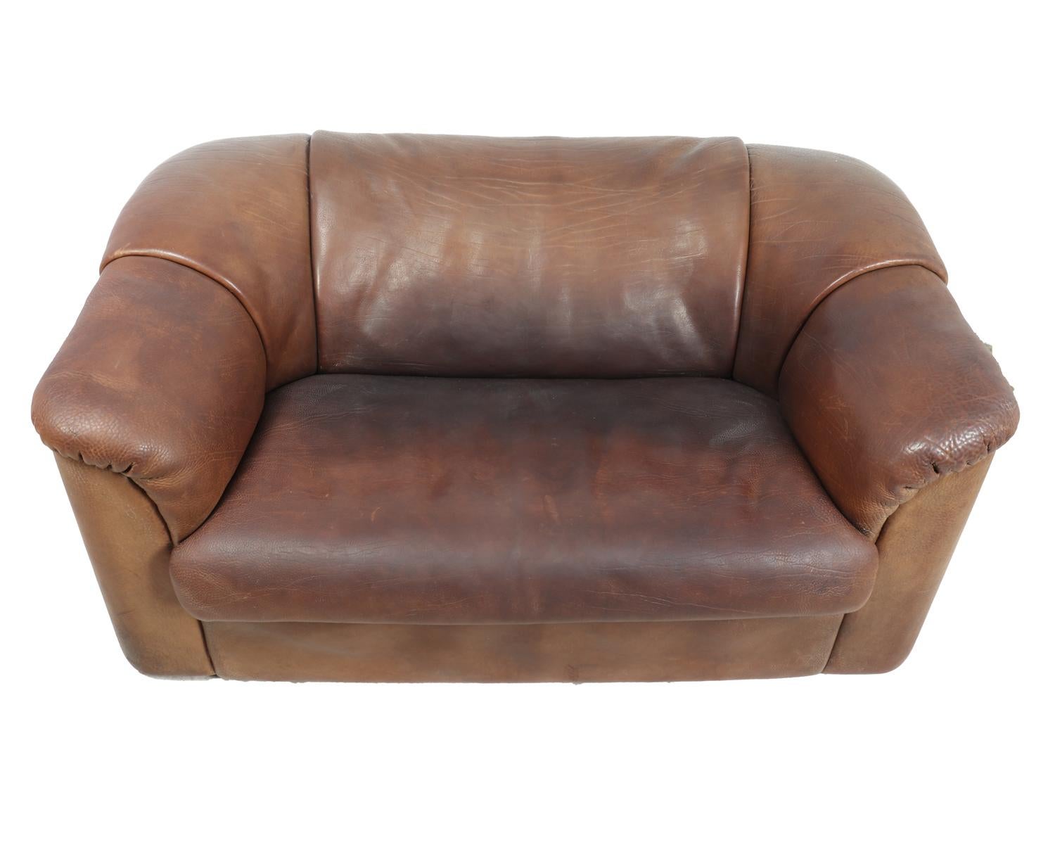 DeSede DS45 Sofa and chairs in Brown Neck Leather

A DeSede two-seat sofa produced in 5mm thick brown aniline neck leather the sofa is very heavy, 90kg and very solid, there is no damage to the leather and very little signs of wear

Age: circa