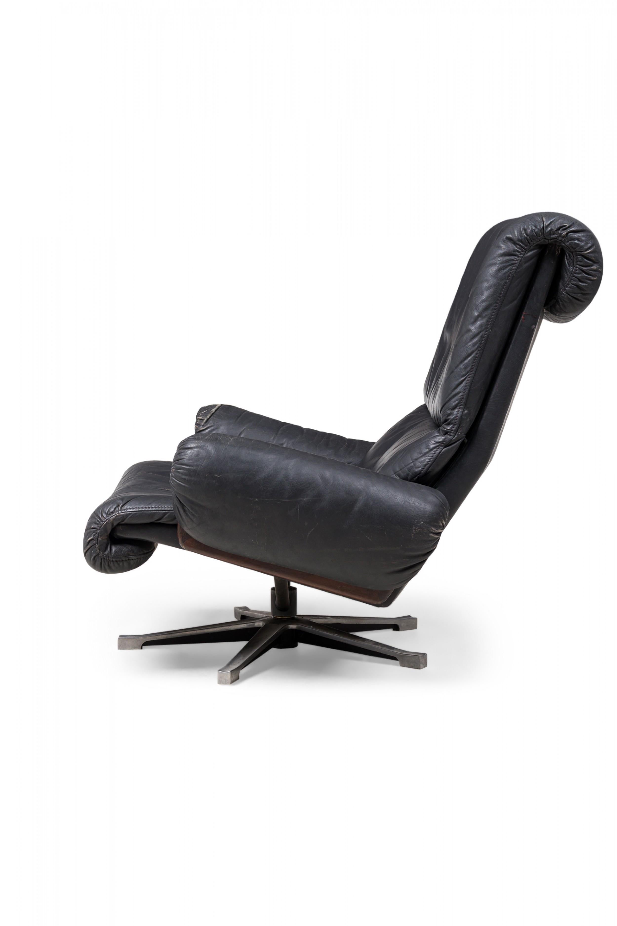 Desede Midcentury Swiss Metal & Black Leather Upholstered Swivel Chair In Good Condition For Sale In New York, NY