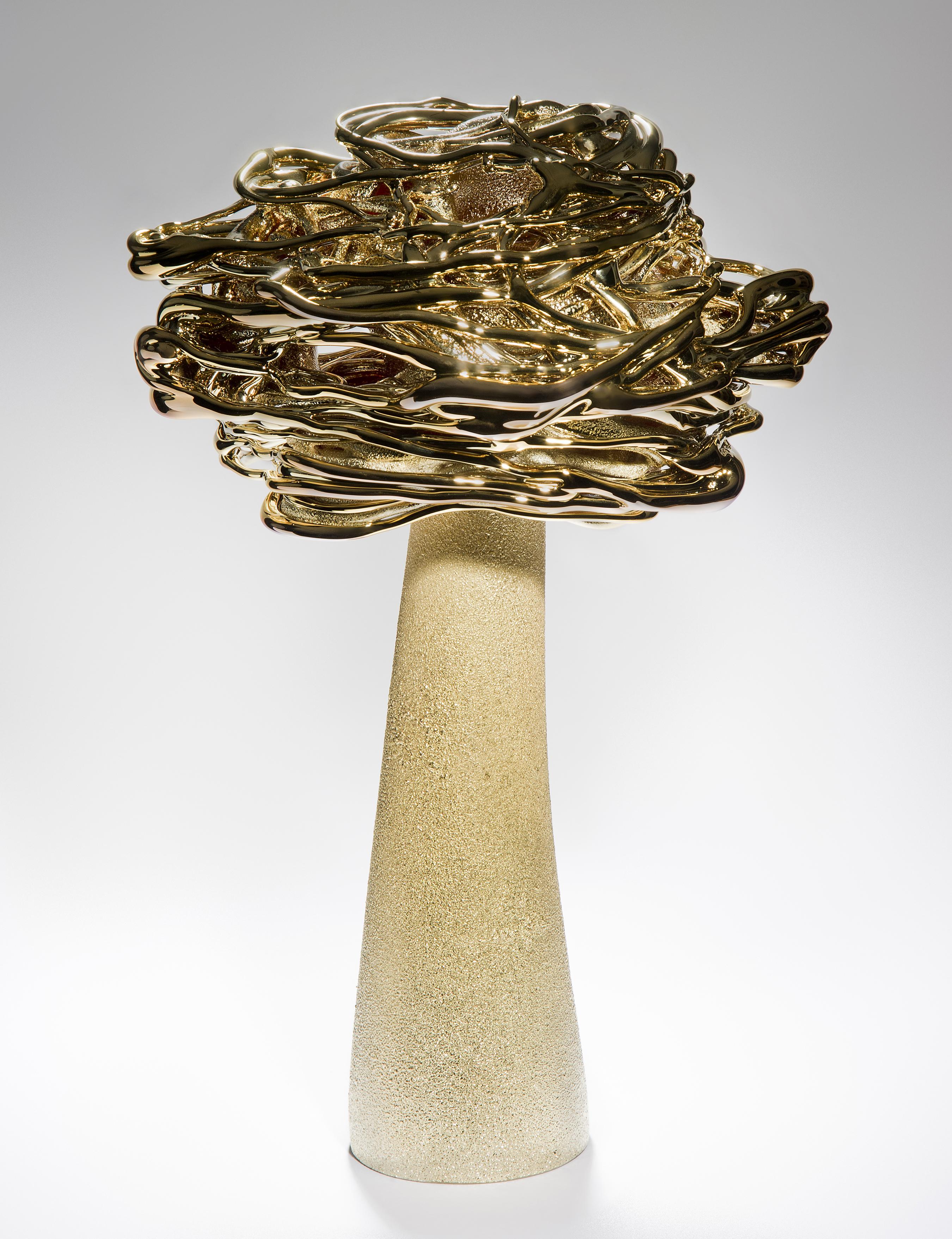 Desert Flower, is a unique brass and glass sculpture by the Lithuanian artist Remigijus Kriukas. Blown and hot sculpted to create this substantial artwork, the final piece is finished with a fine coating of brass.

In 1985 Remigijus Kriukas