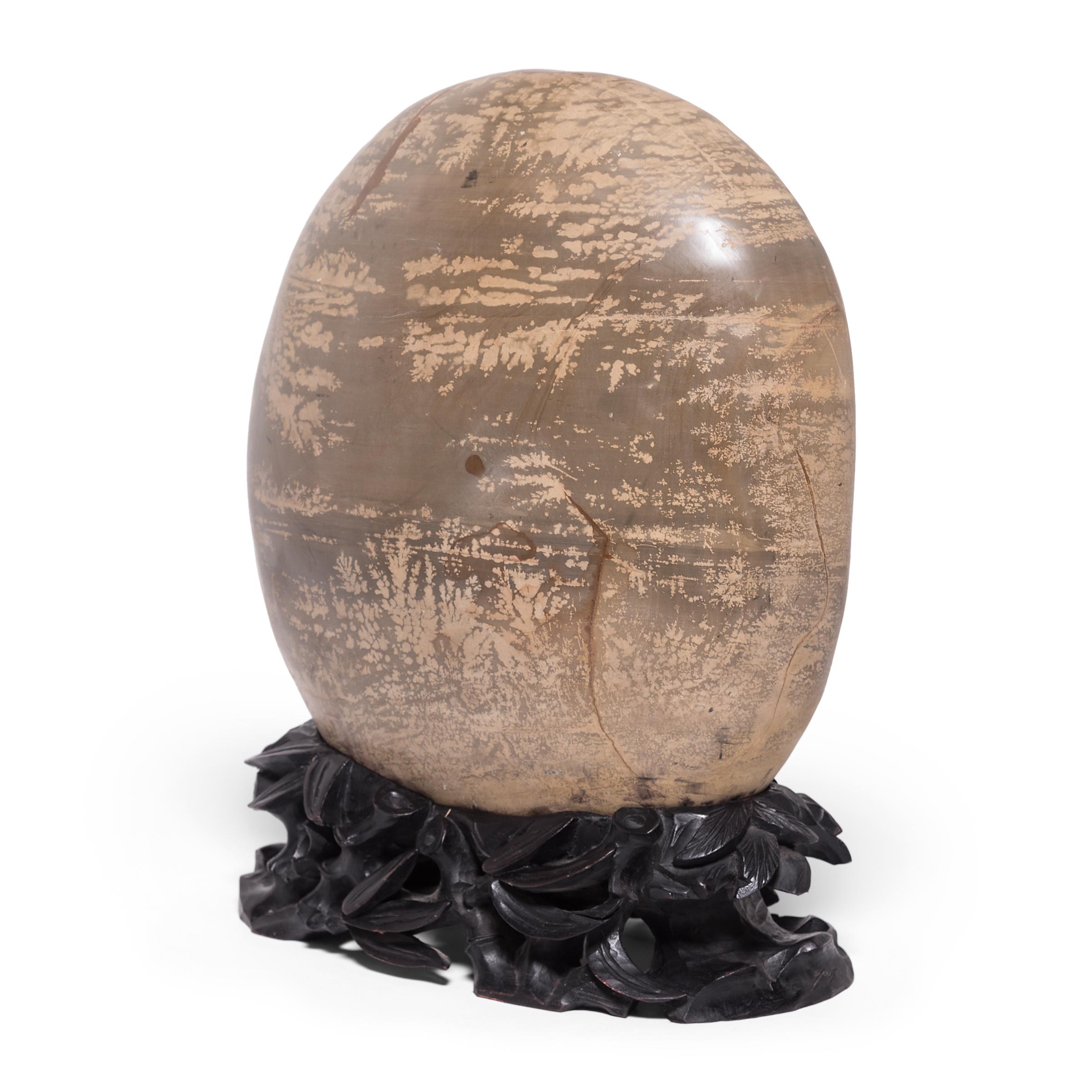 A well-chosen stone is a focal point of both a traditional Chinese garden and a scholar's studio, evoking the grandeur of nature and inspiring creative thought. Meditation stones offer the mind a place to focus - not unlike modern abstract art, each