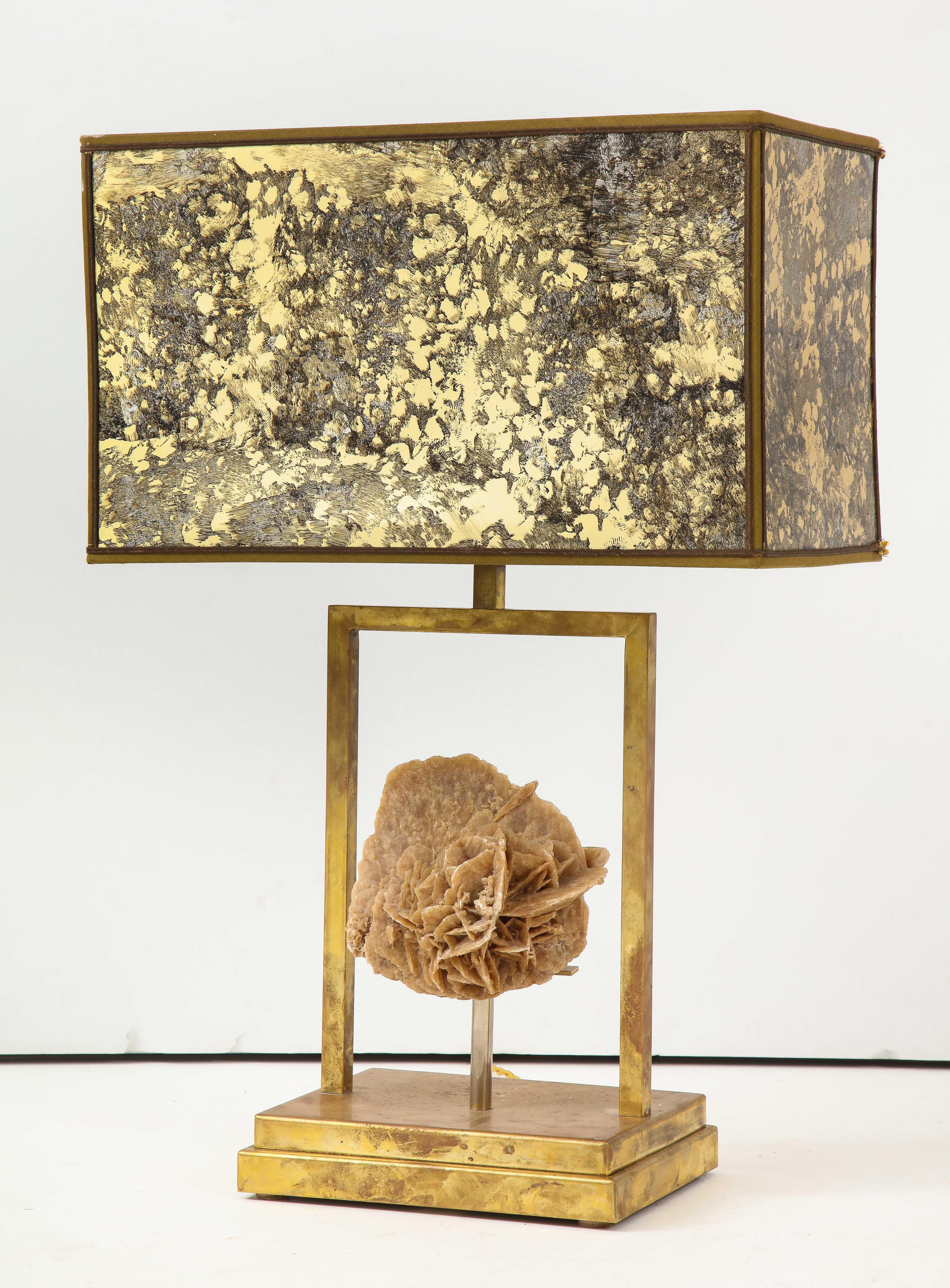Gorgeous table lamp with organic desert rose gypsum mineral mounted on a minimal brass base. Topped by a metal, rectangular lamp shade with interesting oxidation throughout. A bright accent that adds texture and warmth to any space. Rewired for