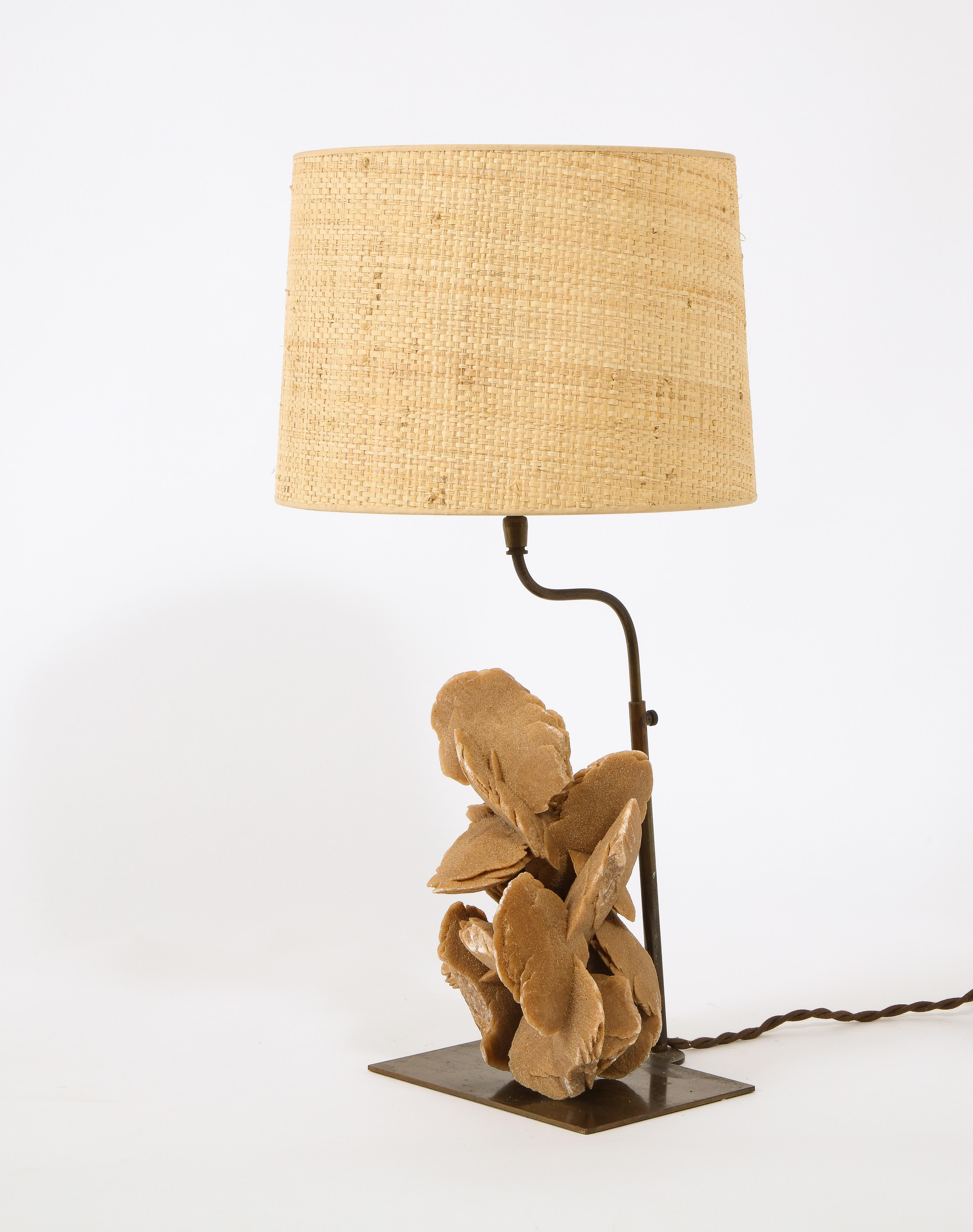 A fascinating lamp using a Selenite mineral known as a Desert Rose mounted on an adjustable brass base.

Shade not included.