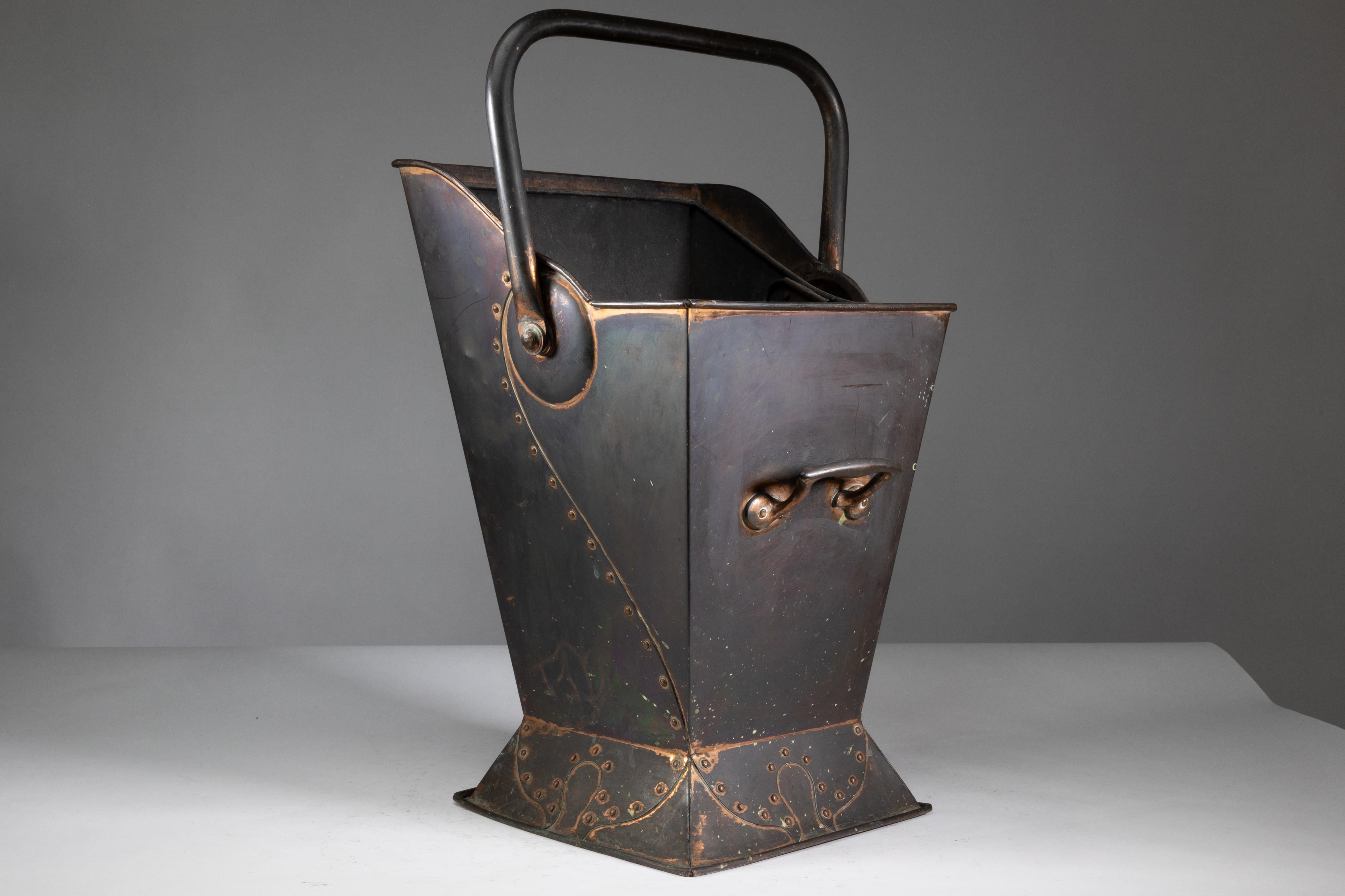 Arts and Crafts Robert Hilton. An Arts & Crafts copper coal bucket with a single flower in seed. For Sale
