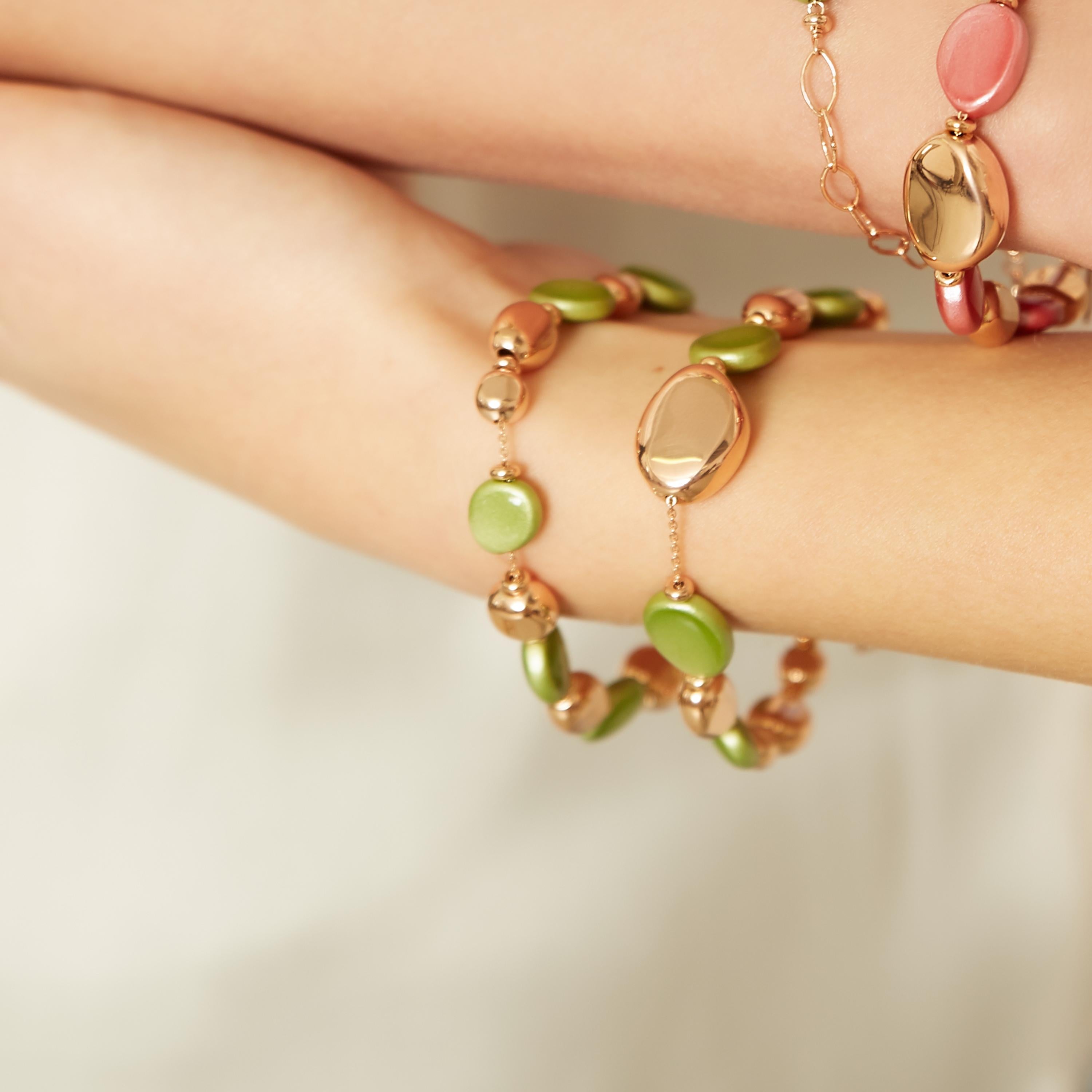 ROSSOPREZIOSO MISSISSIPI Bracelet is made in reclaimed olive wood, lacquered and hand-enamelled embellished with 24-karat rose gold-plated 925 silver nuggets.
The color of the wood is a bright and shining light green.  
This bracelet is designed and