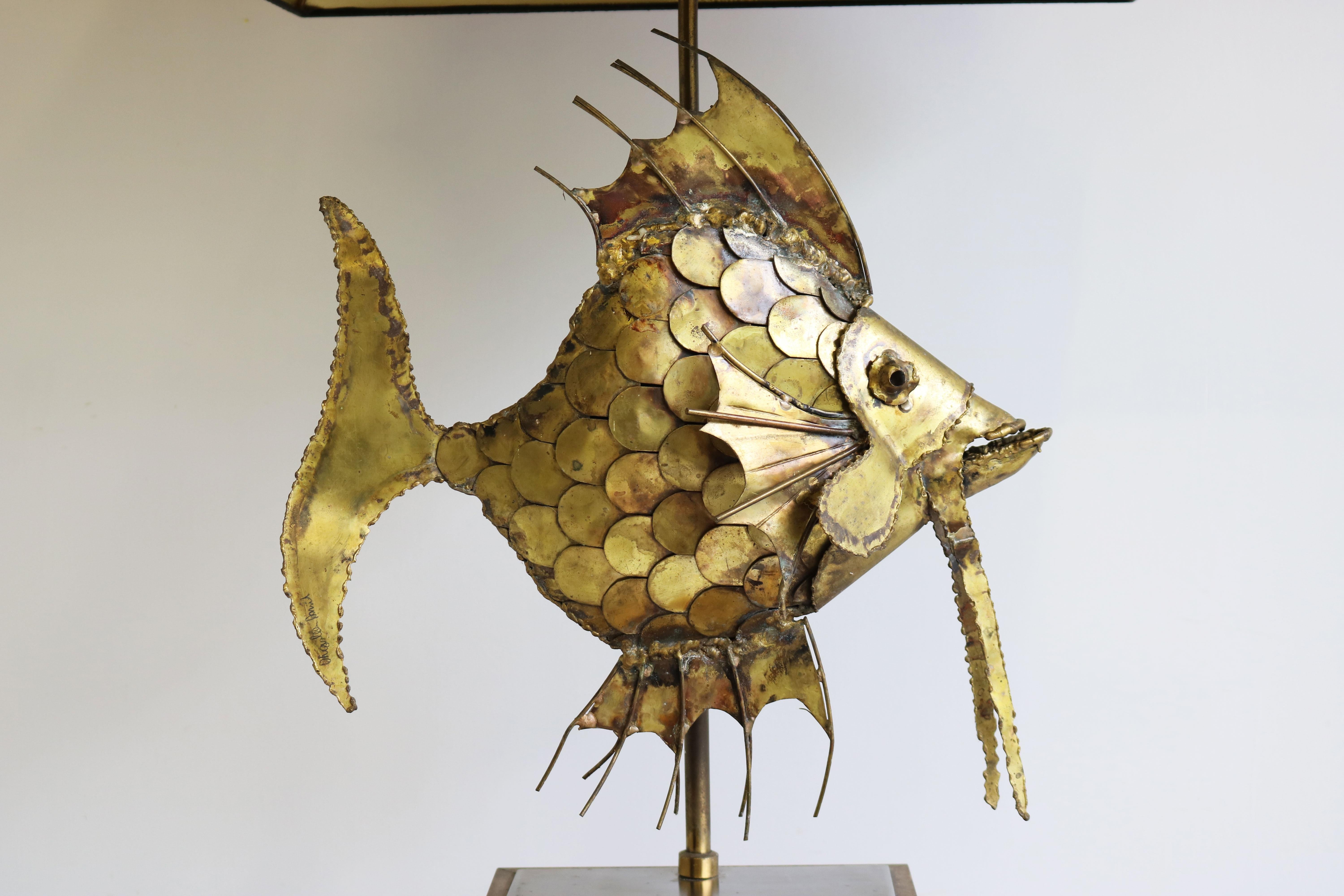 Gorgeous brutalist style fish sculpture in brass by famous Belgium artist Daniel d'haeseleer 1970 signed on the tail by the artist.
The fish is very large and looks amazing, gorgeous craftsmanship & attention to detail.
The chandelier has 2 light