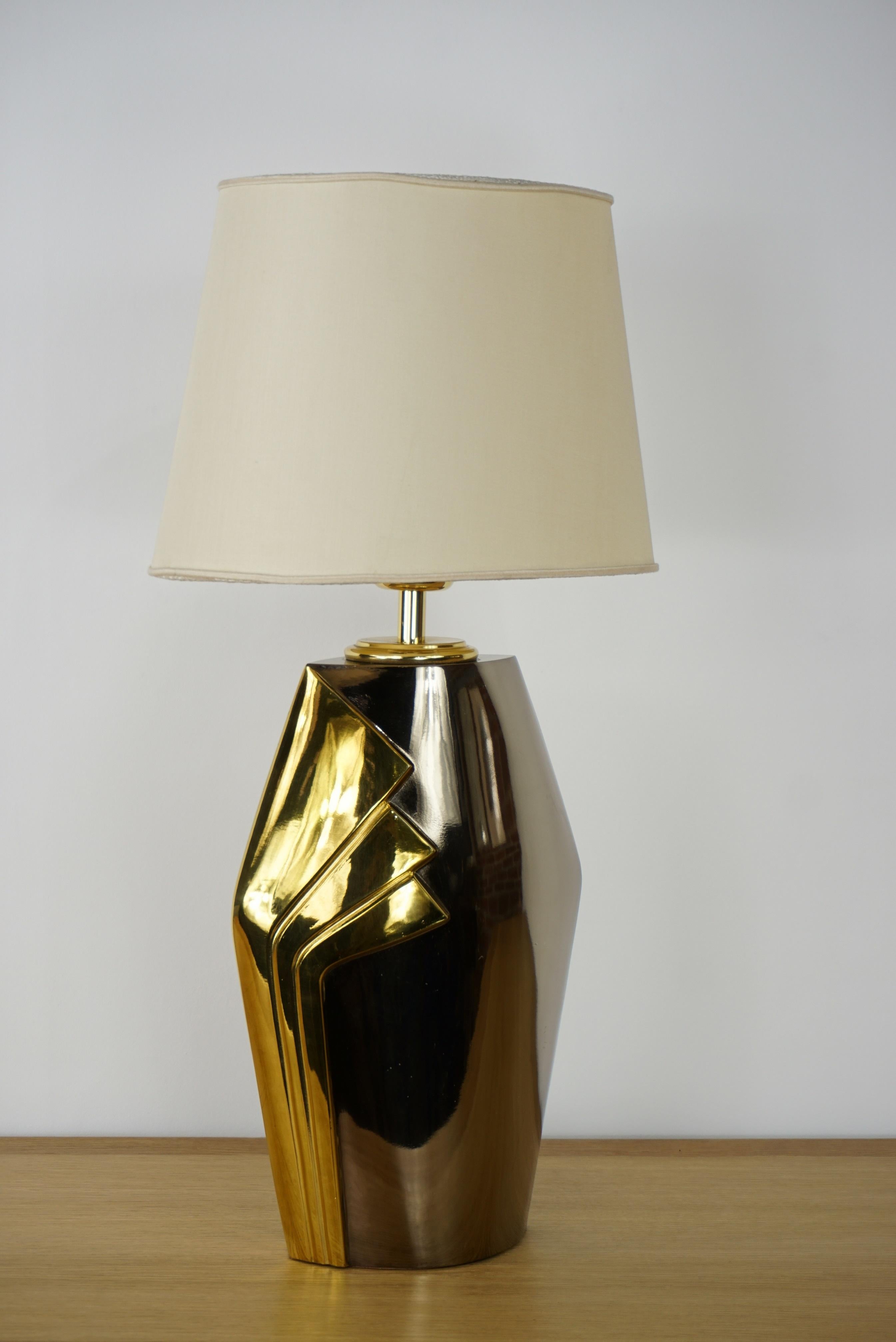 Design metal and brass lamp with harmonious and precious lines. Prestigious and elegant