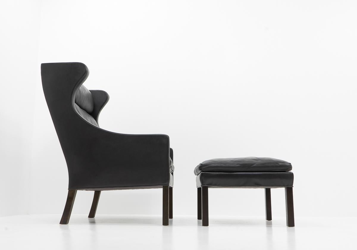 Danish Design Classic Black Leather Wingchair and Footstool by Borge Mogensen, 1960s For Sale