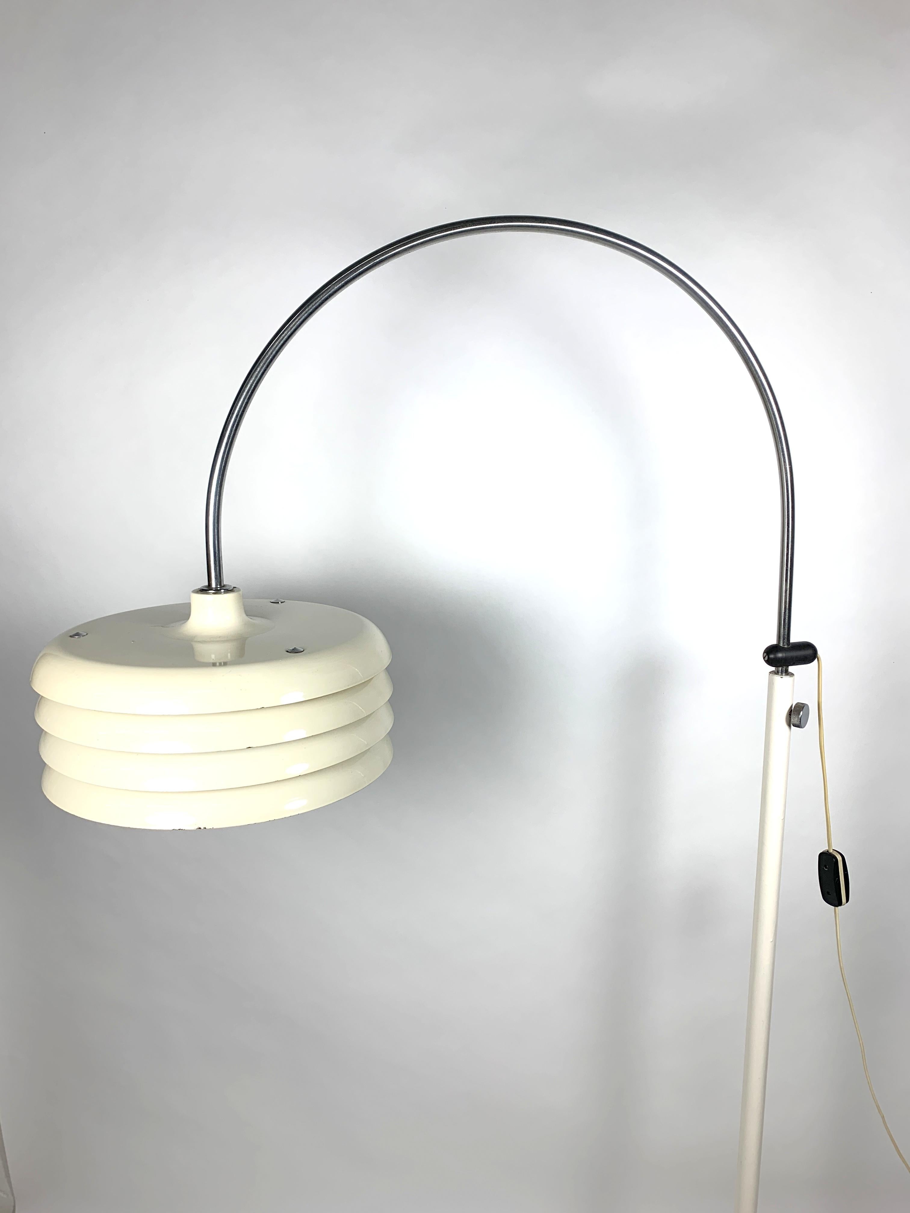 Iconic floor lamp designed by designer Tamas Borsfay. Enamel paint coated and nickel-plated floor lamp has adjustable height, it's in working order and good condition.
  