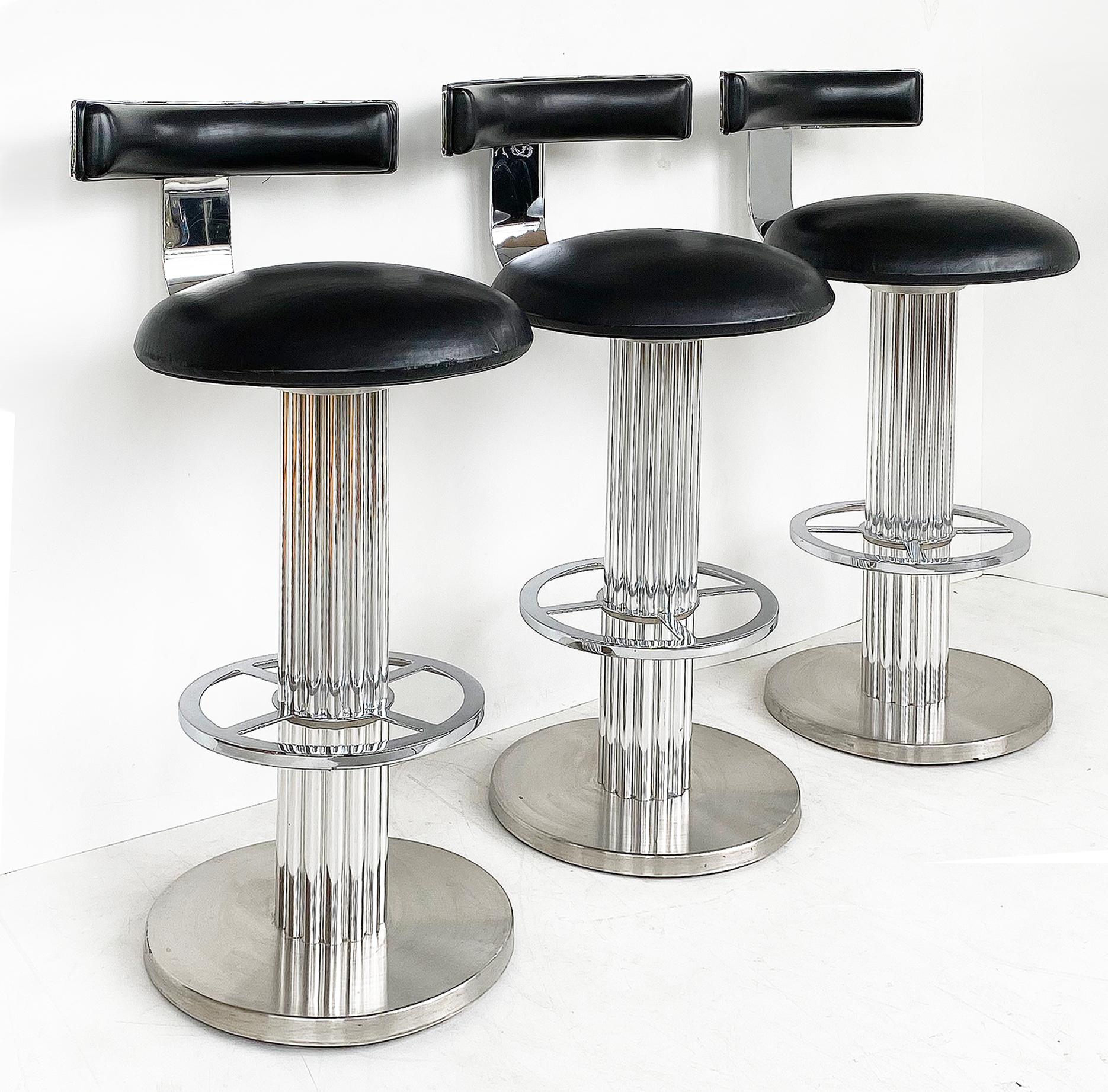 Design for Leisure Swivel bar stools with chrome, nickeled steel, black leather

Offered is a set of three Design for Leisure swivel bar stools. These high-quality, heavy and substantial stools are constructed with chrome and nickel-plated steel.