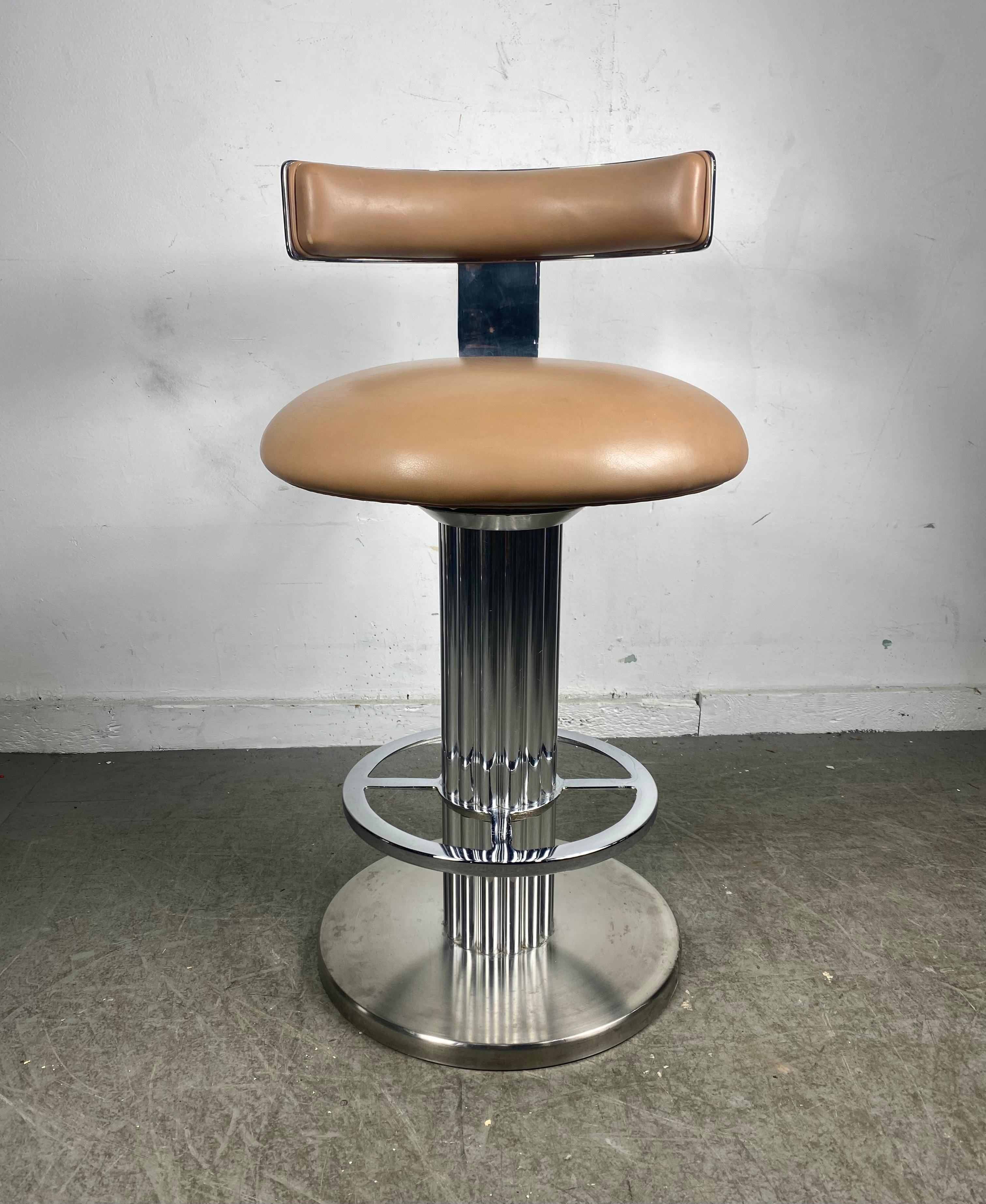 Stunning Set of Art Deco Revival Chromed Nickel swivel bar/counter stools by Design for Leisure. Amazing design, retain their original leather upholstery, which does show minor signs of wear however remains intact with no rips or tears.Superior