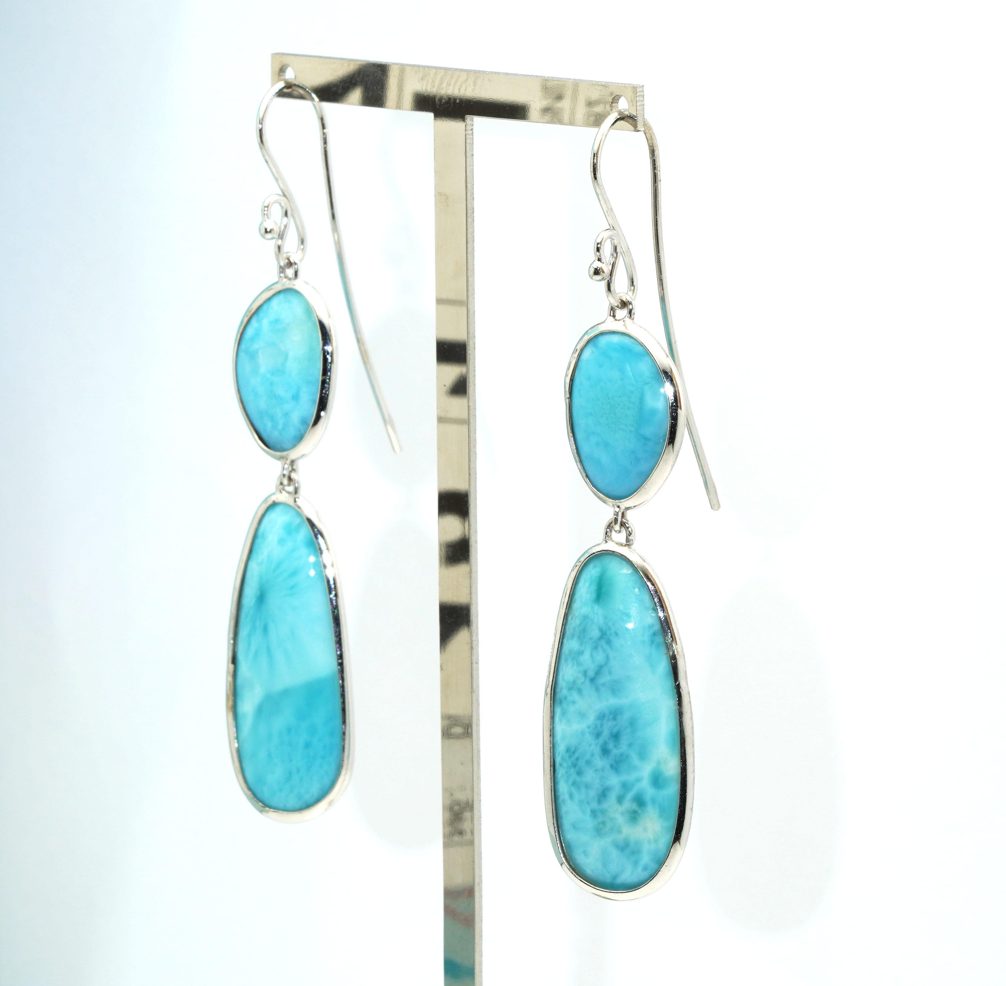 14 kt White gold pair of earrings with Larimar.
Gold Color: White
Dimensions: 65mm. width
Total weight: 9.44 grams

Set with:
- Larimar
Cut: Cabochon