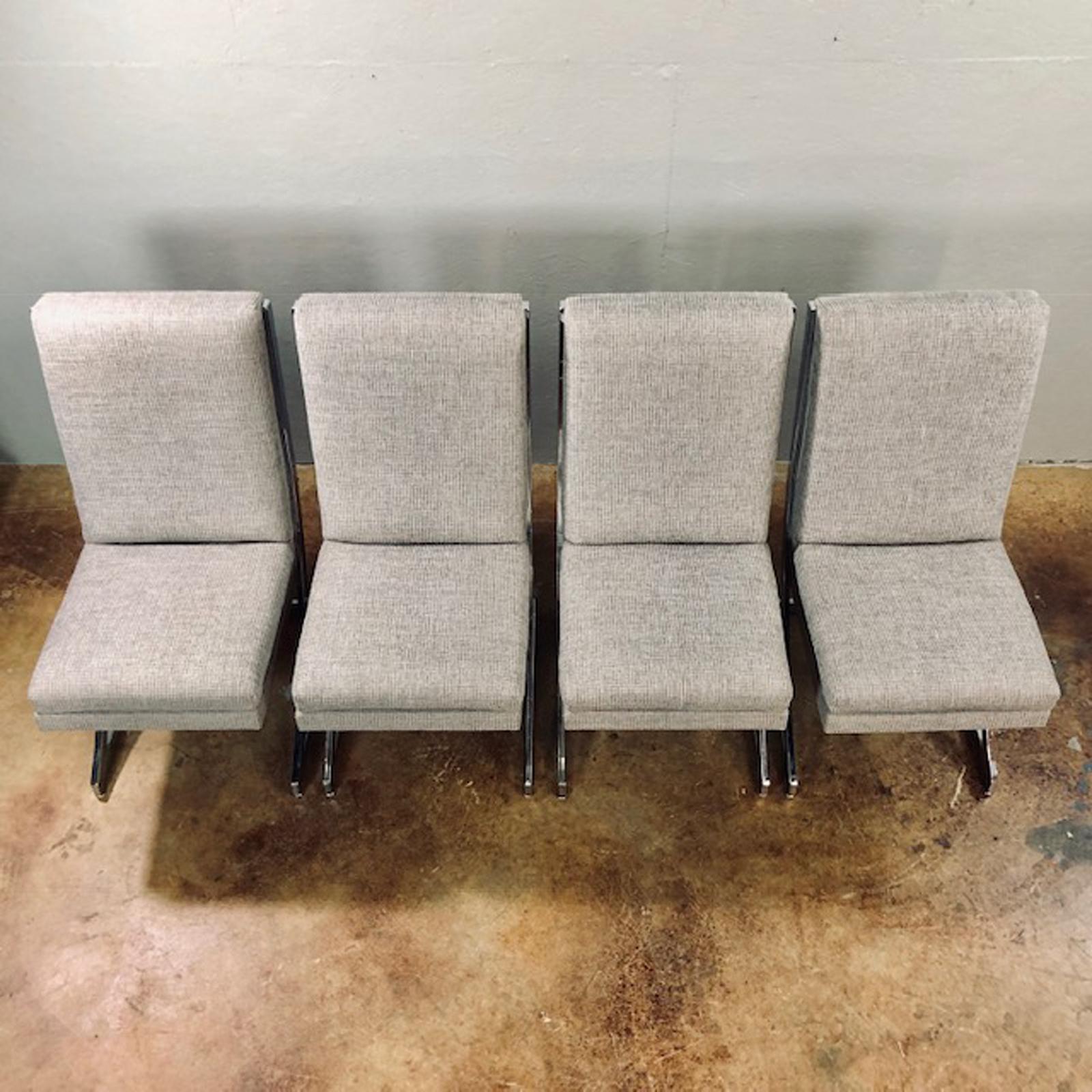 Newly reupholstered set of four DIA chrome sling back style dining chairs. Unique and stylish. Circa 1970's. Fabric is a new type of California made and produced fabric. Long lasting and long wearing. Easy to clean and soft and supple polyester.