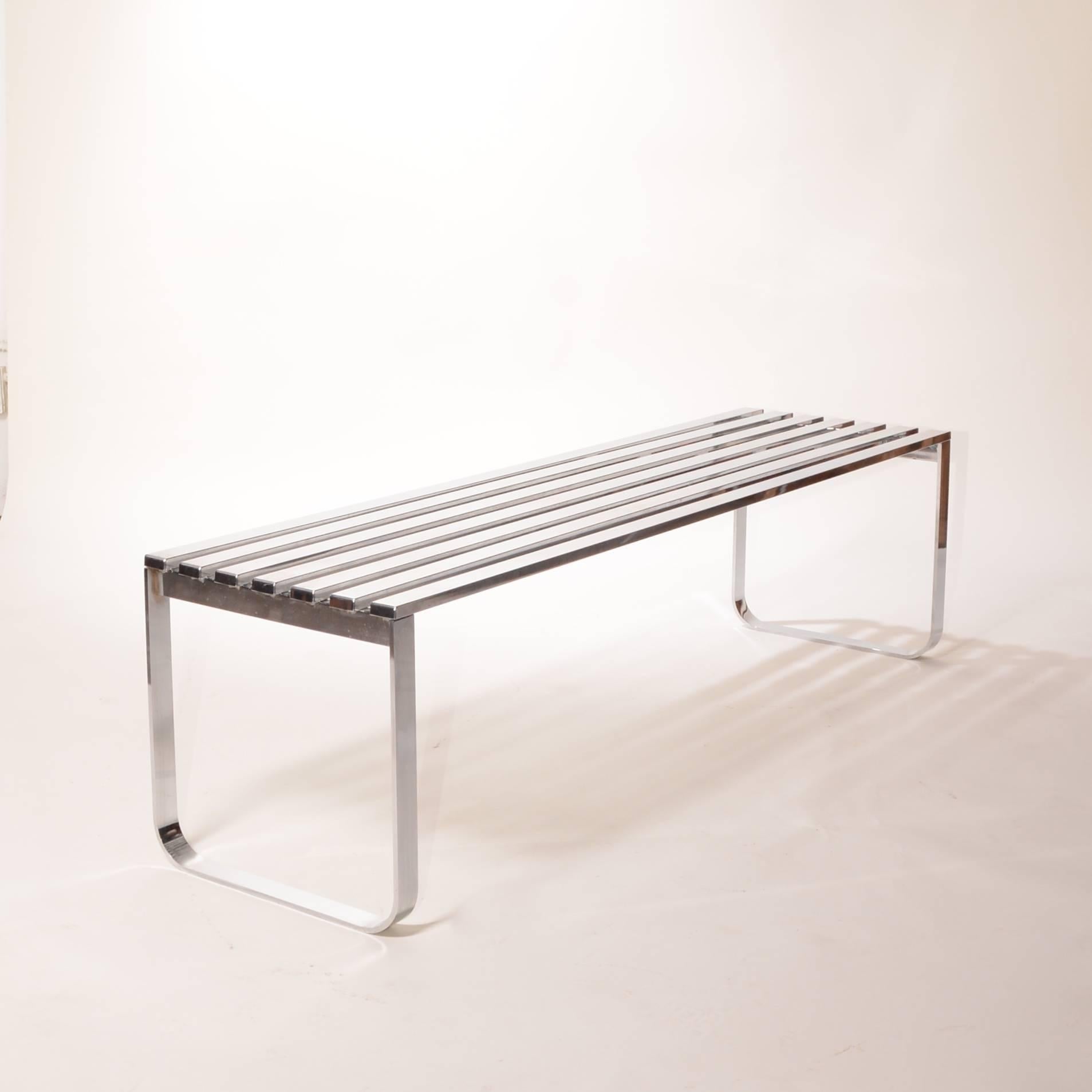 Vintage chrome bench for the Design Institute of America in great vintage condition. Has light wear on the top surface. Retains DIA sticker.