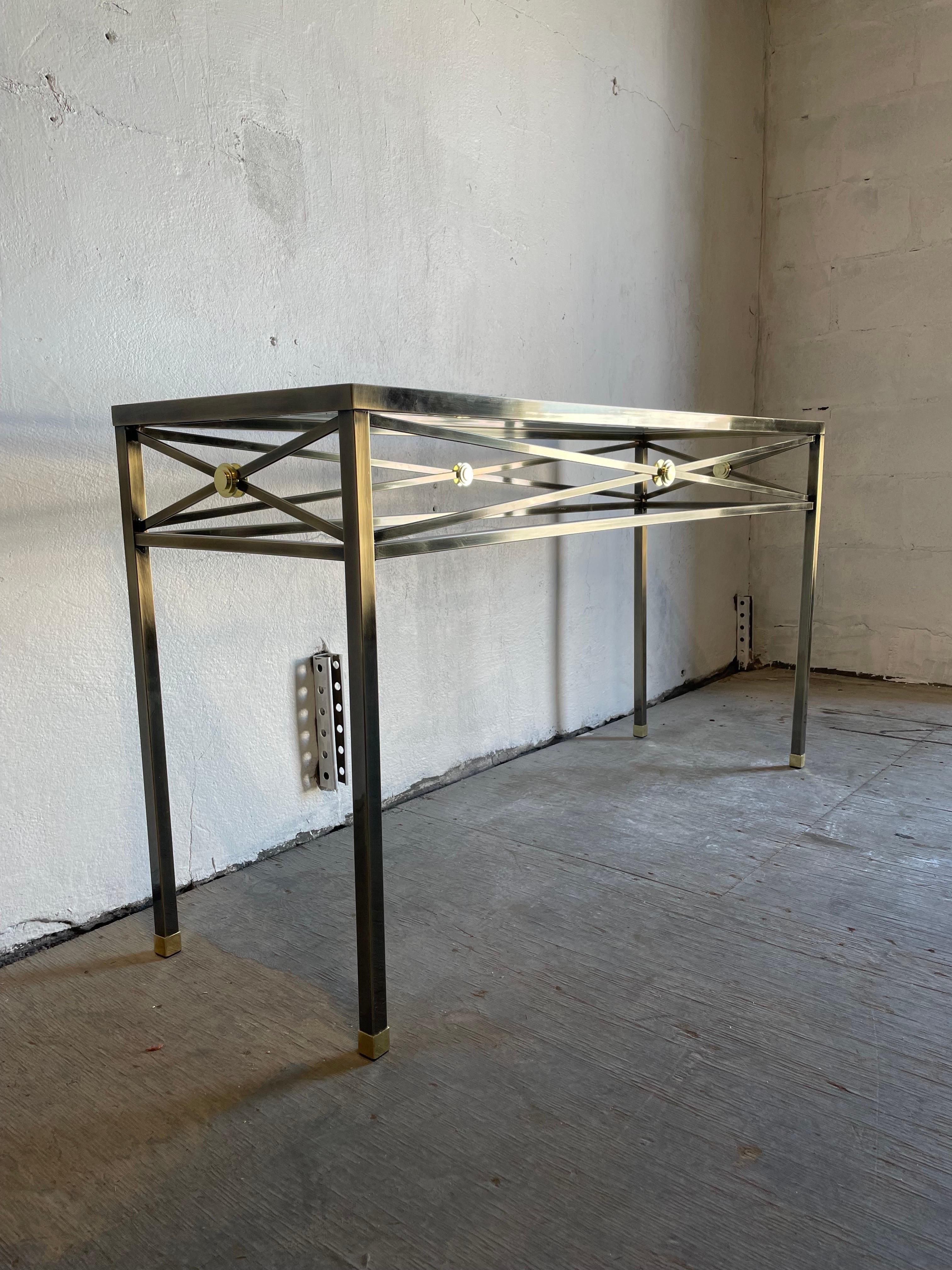 Brushed bronze console / sofa table by Design Institute of America. Classic modern neoclassical X form stretchers with brass medallions with capped legs.
Can deliver curbside to NYC/Philly $300.