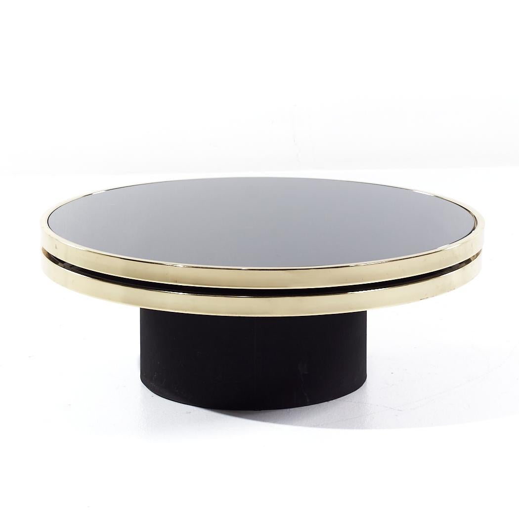 Design Institute of America Mid Century Black & Brass Revolving Two Tier Coffee Table

This coffee table measures: 36 wide x 36 deep x 14.25 inches high
When expanded the width of the table is 55 inches

All pieces of furniture can be had in what we