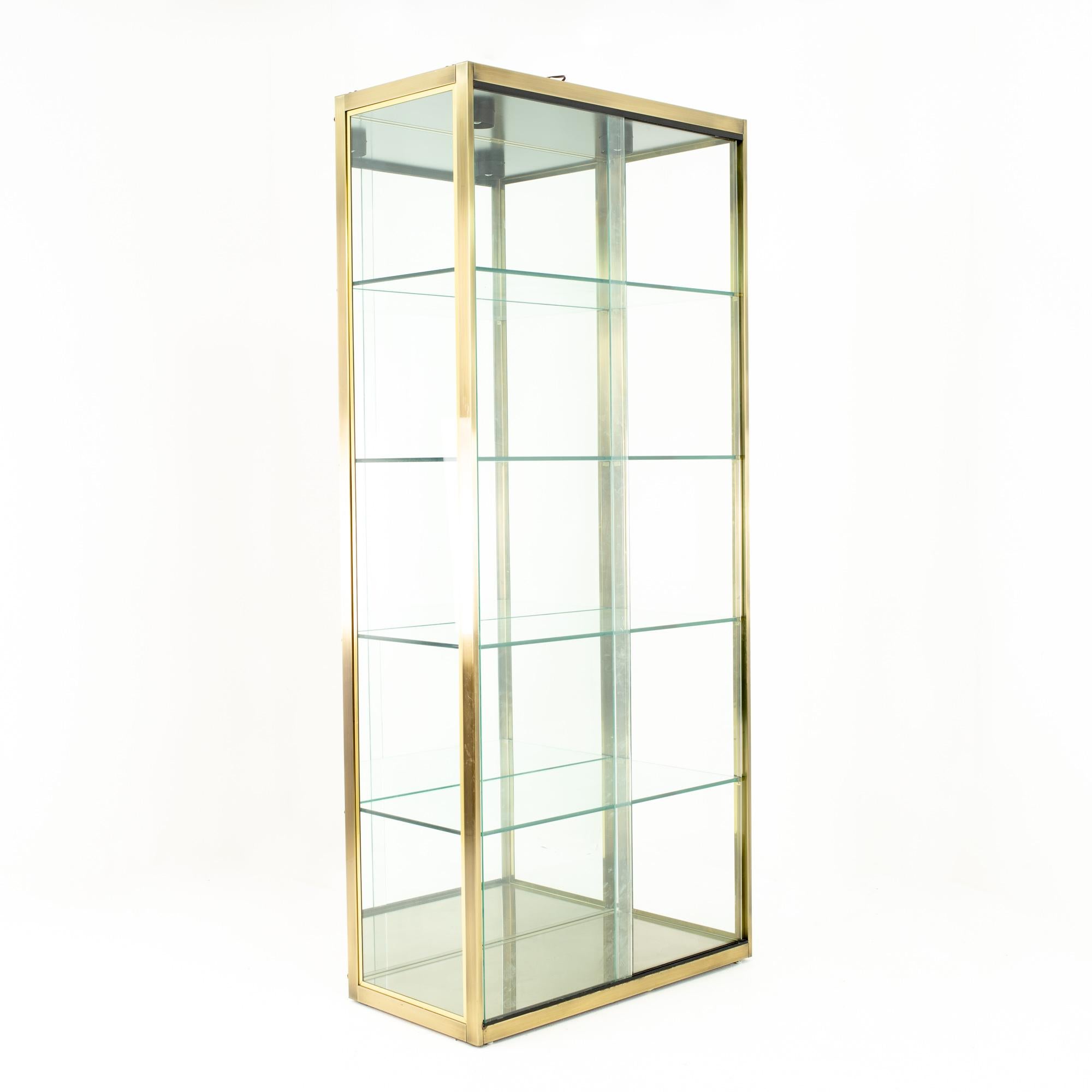Design Institute of America midcentury brushed brass and glass display case

Display case measures: 36 wide x 18.5 deep x 82 high

This price includes getting this piece in what we call restored vintage condition. Upon purchase it is fixed so