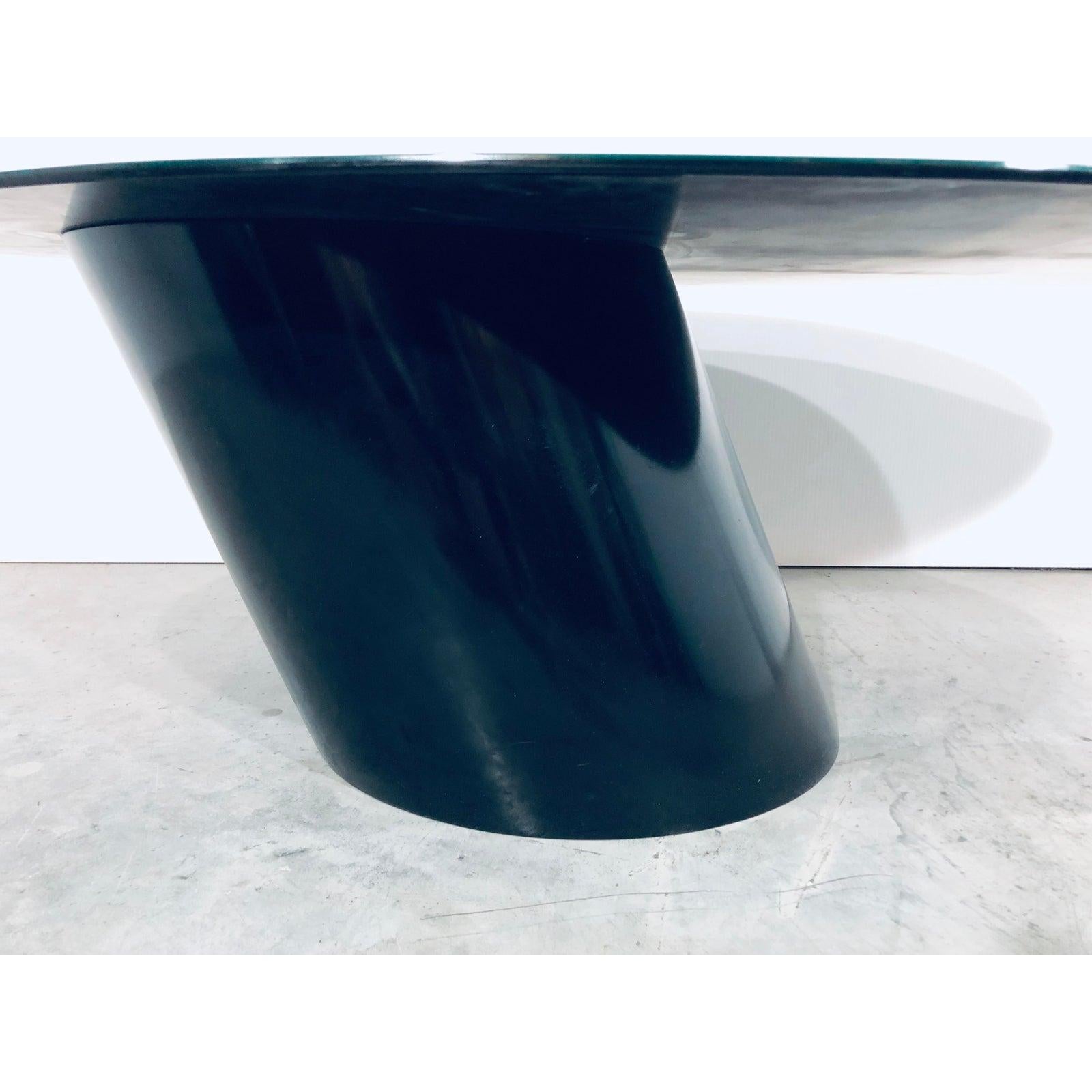 Black beveled glass with black lacquered wood base cantilevered coffee or cocktail table by Design Institute of America. Signed on the inside of base.
