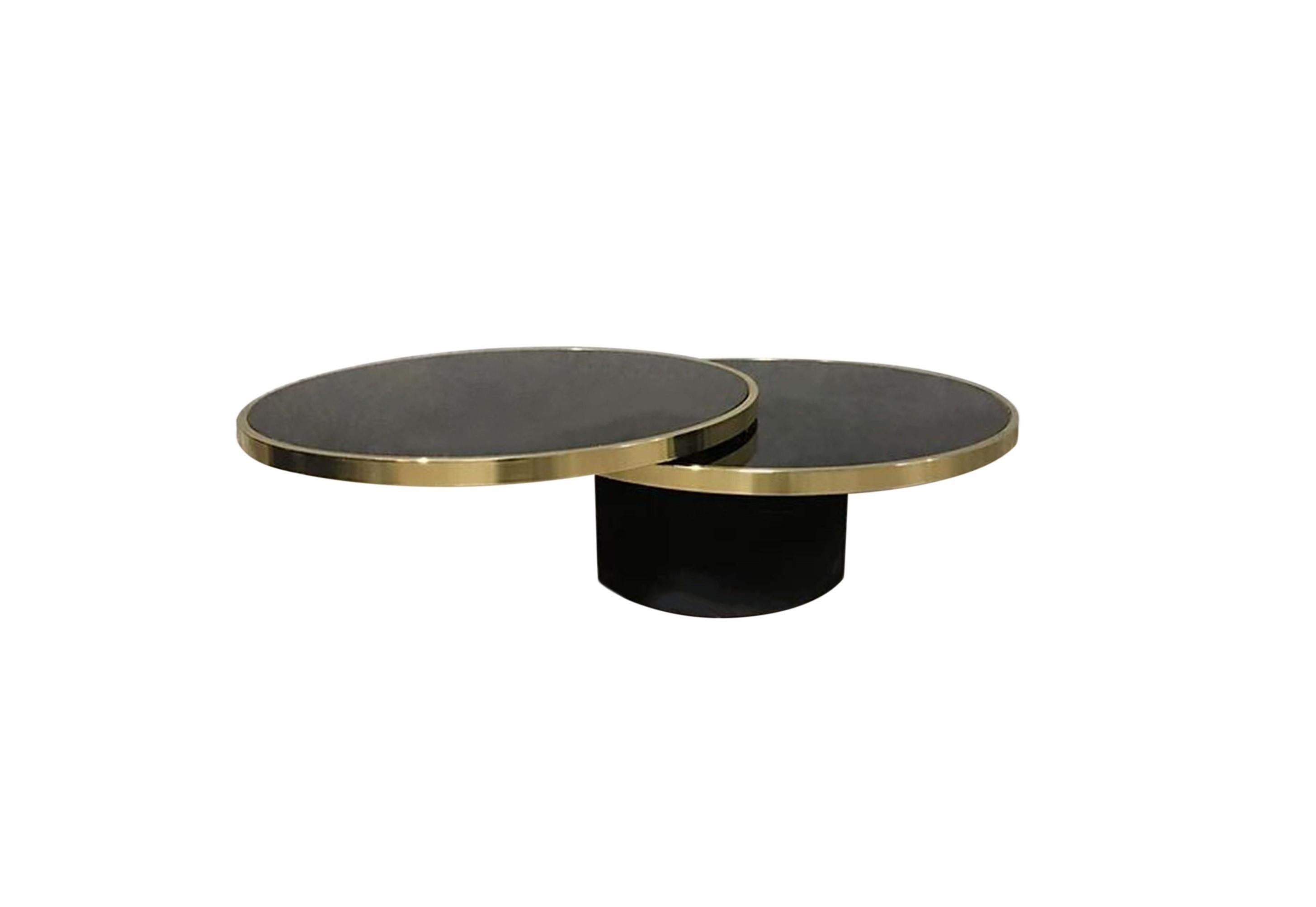 Stunning piece by Design Institute of America. Highly functional two tier coffee or cocktail table designed by Richary Berry in the 70's. Features newly re-plated brass double ring frames that hold round reverse black painted glass tops floating on
