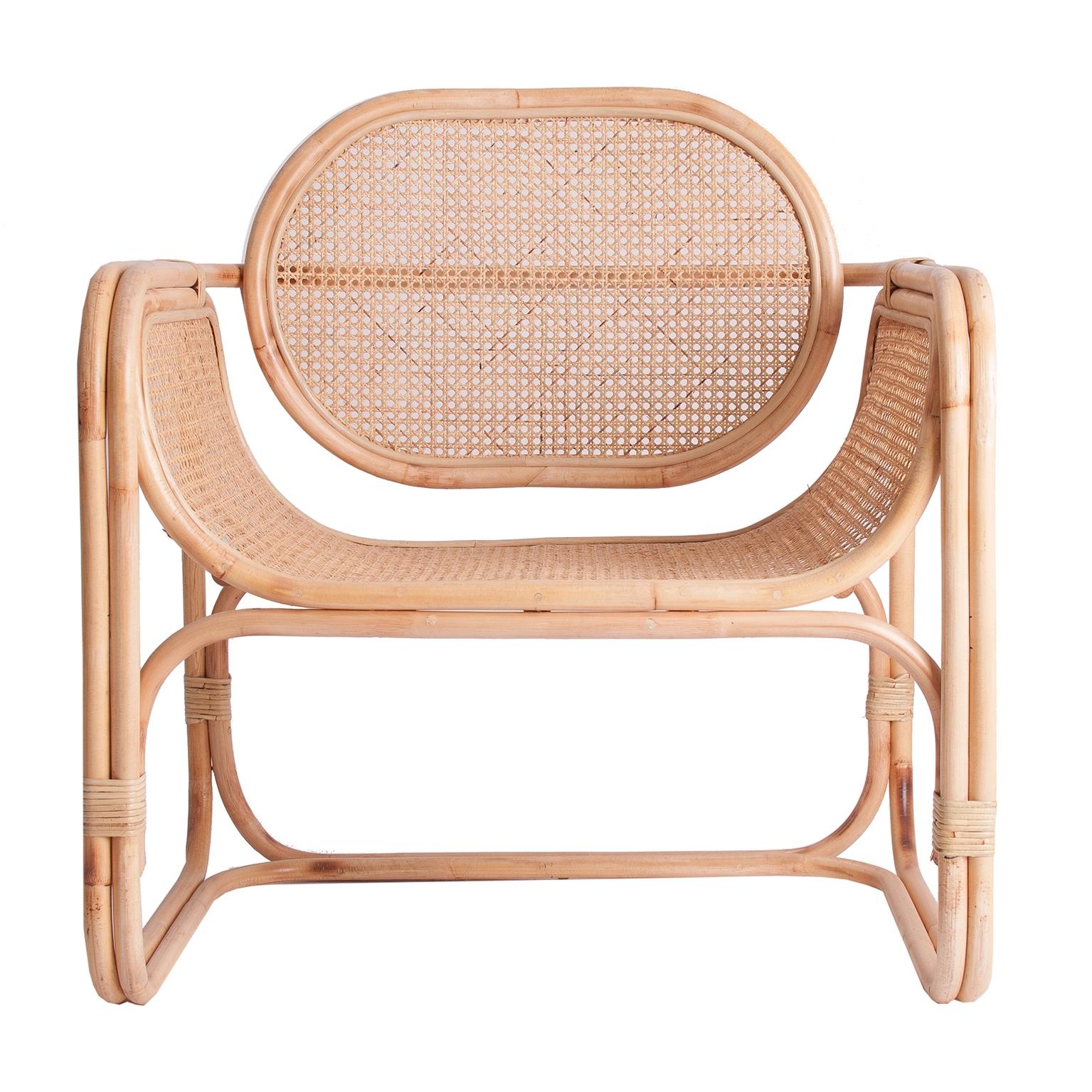 Design and original lounge armchair with cane and natural rattan airy structure.