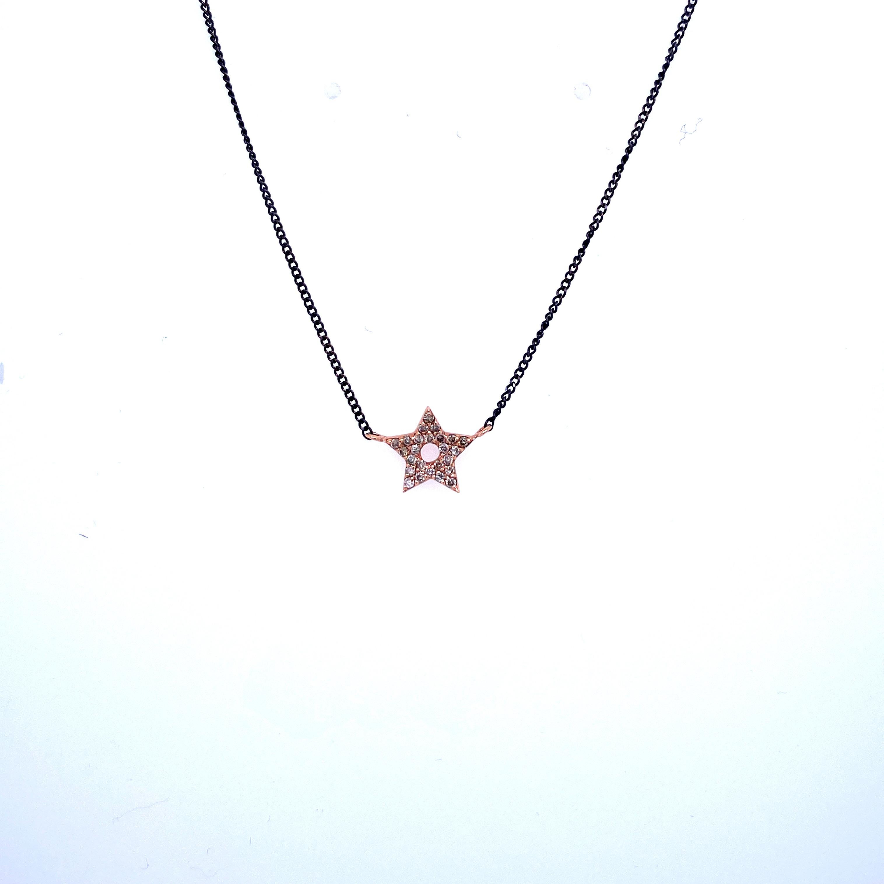 Beautiful design necklace, it features a Star shape pendant made of 14k Rose gold and set with 0.10 carats of colorless diamonds (G Color IF clarity). The Necklace is made of 14k black gold.

Wearable in three lengths, choker included, thanks to the
