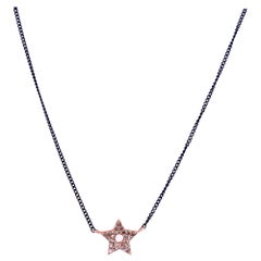 Collier en or noir avec diamants en forme d'étoile rose