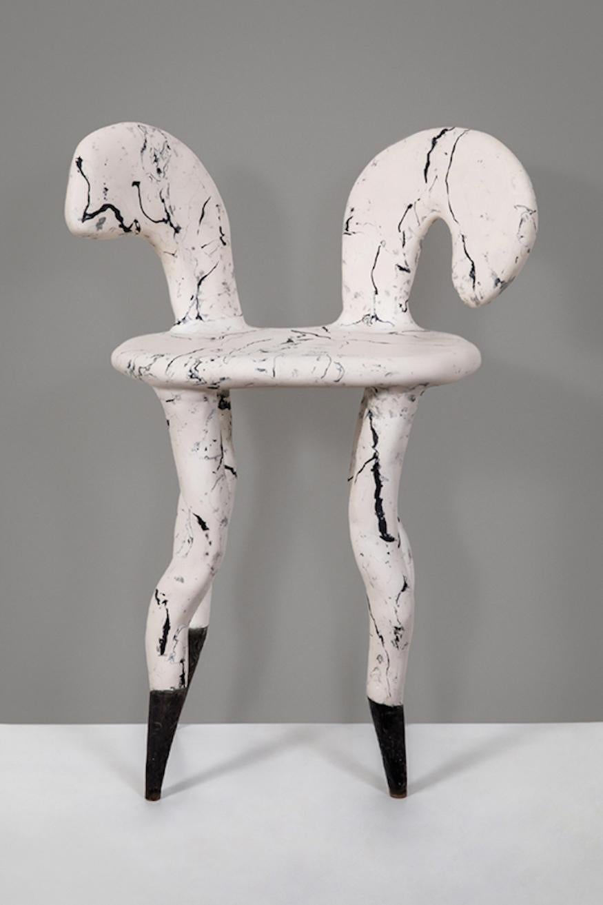 Indicative of the designer's anomalous creative approach, this one of a kind sculptural chair ('Prima') is a prominent design piece. Handcrafted in stucco marmo (scagliola), the method resembles sculpture making, using steel armature and multiple