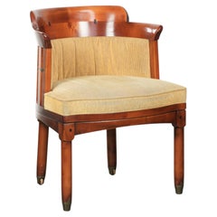 Design side/desk chair with a wooden frame and yellow fabric upholstery