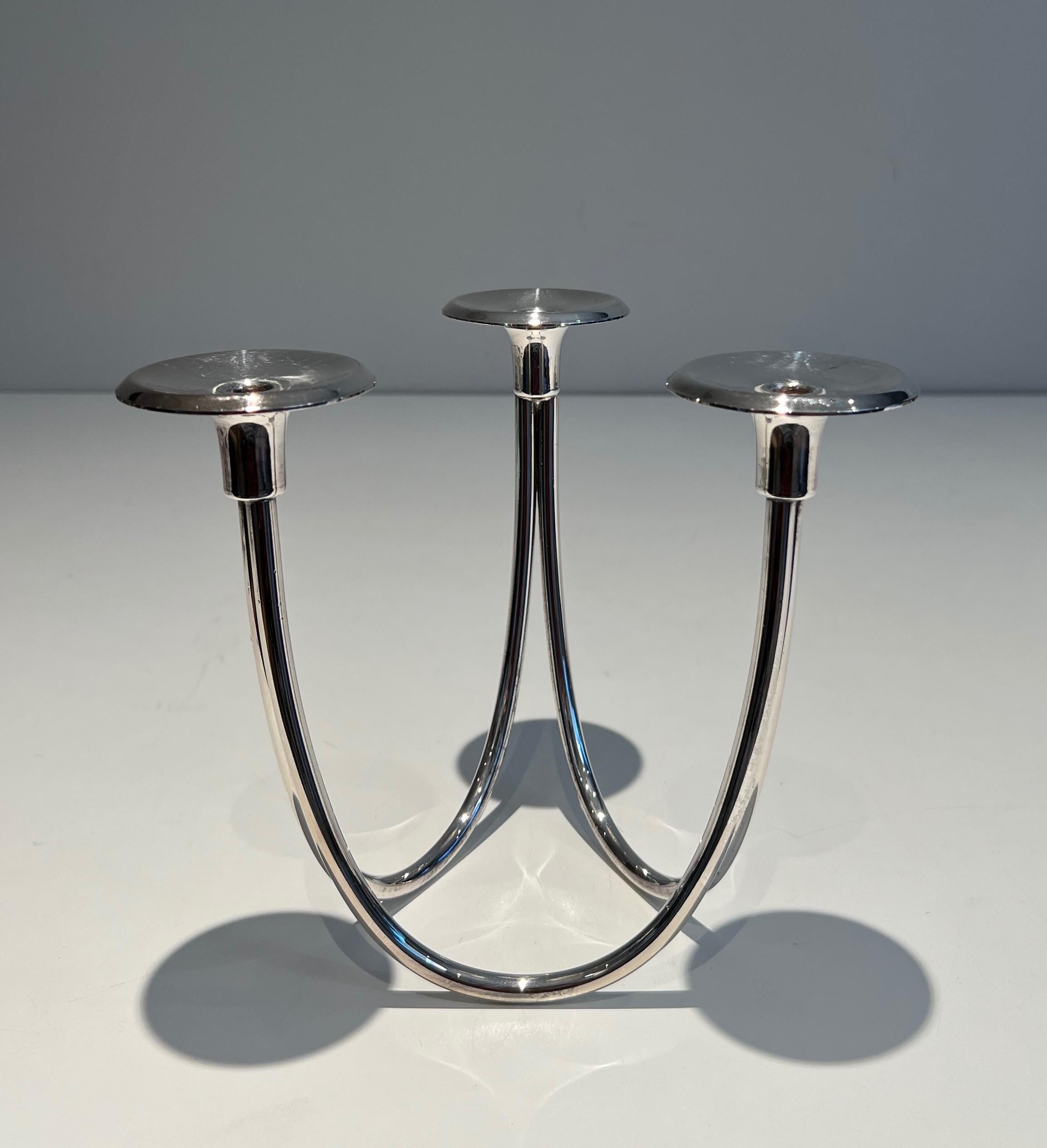 This nice design candlestick with 3 candles is made of silvered metal. This is a French work. Circa 1970