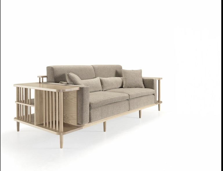A stunning beautiful comfortable sofa with surrounding wooden frame in solid wood. A sofa, a bookshelf and also a divider, perfect for an exclusive space.
Pillows easily come off.
Packed in a plywood box. You can choose from different fabric