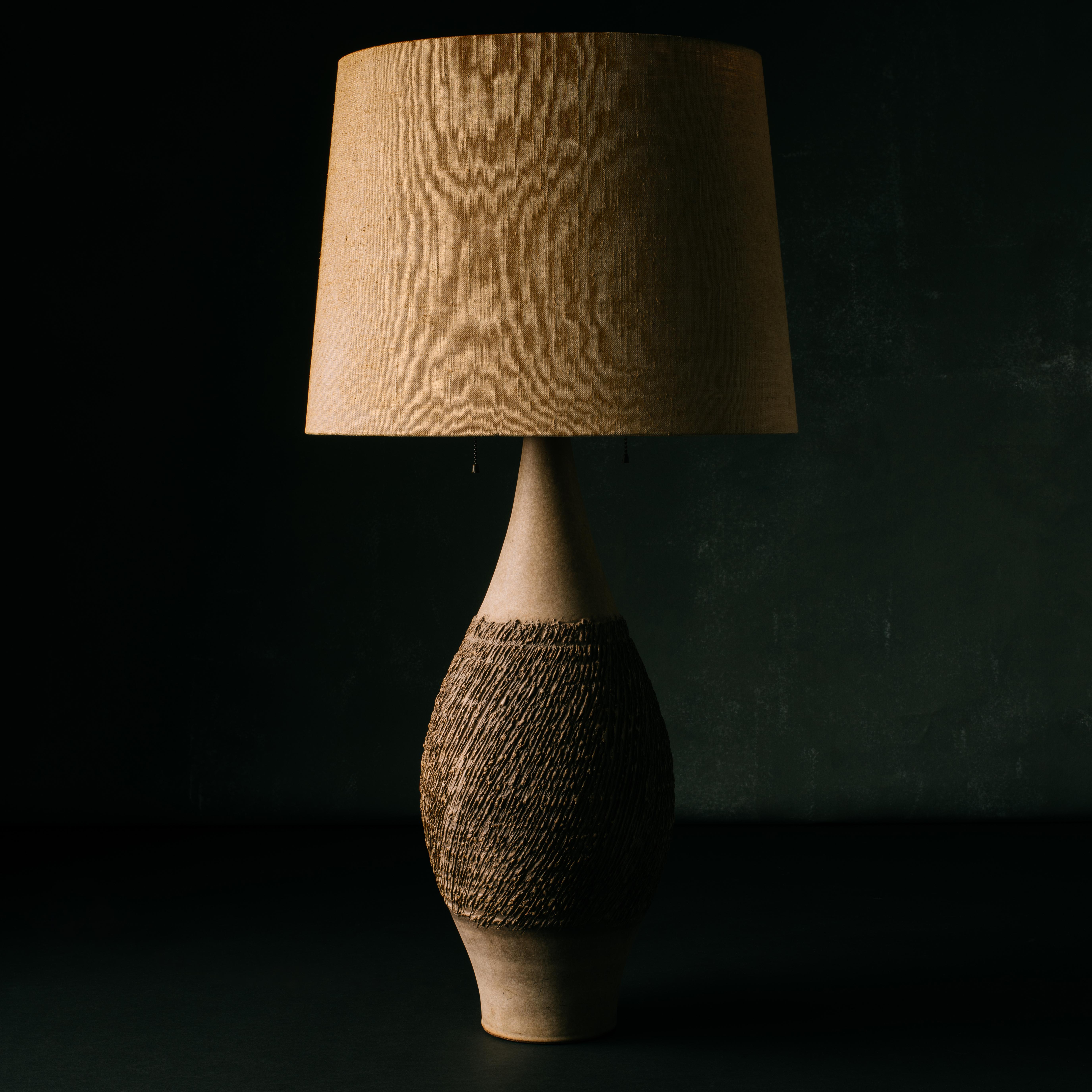 Large scale, handthrown ceramic table lamp from the 3300 Series designed by Lee Rosen for Design Technics with a matte, neutral beige body and hand-applied, organic design finished in a brown glaze. Lamp has its original double socket with a milk