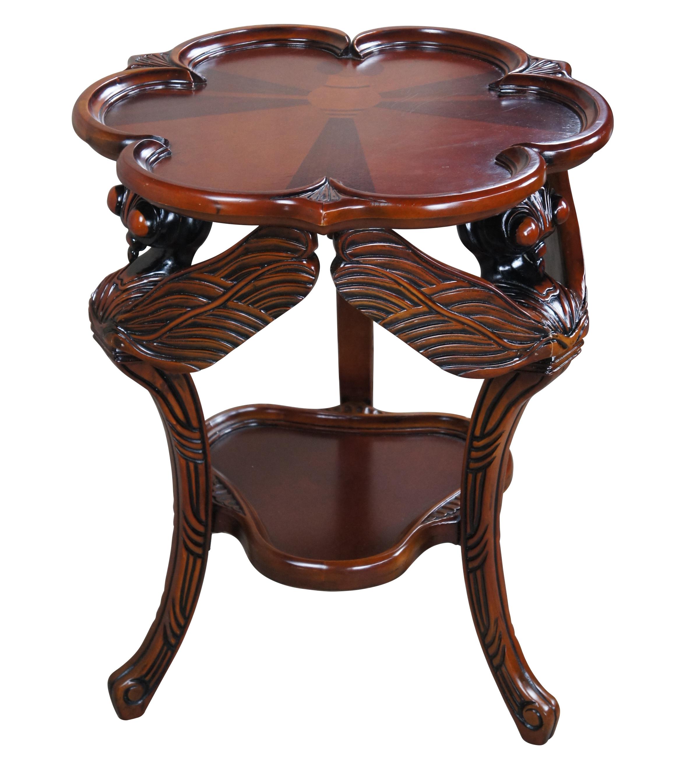 Fraught with French Art Nouveau style, this quality, mahogany occasional table was originally designed in 1900 by noted furniture designer Emile Galle. Features oversized dragonflies' heads and stretched wings, requiring a full week to hand-carve,