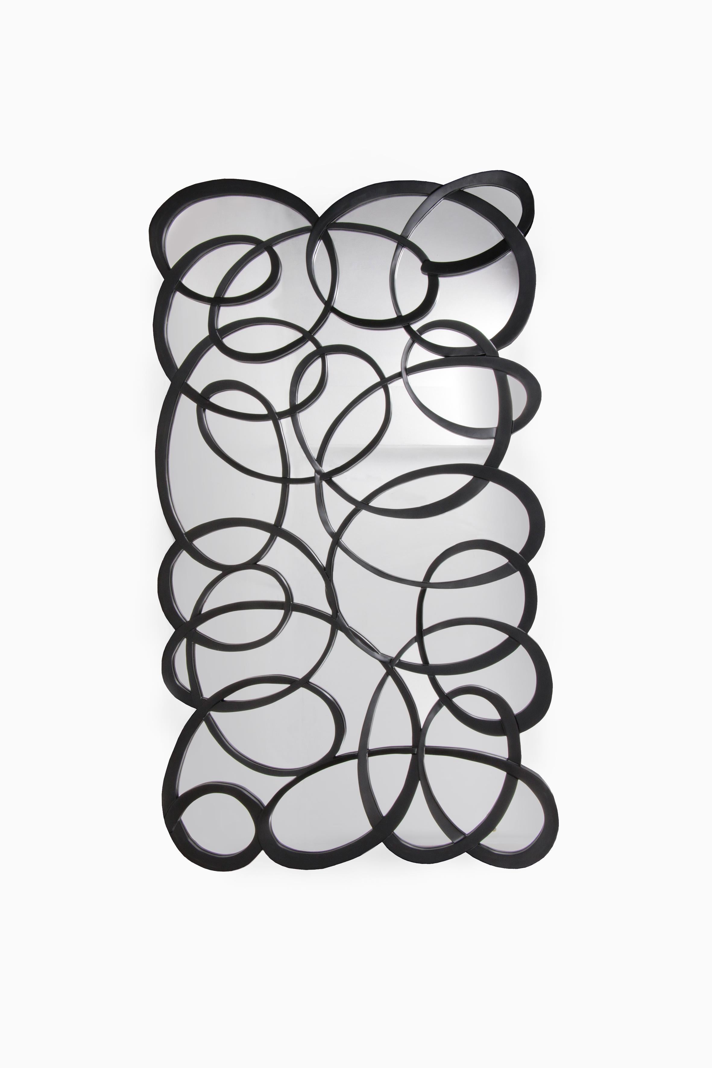Design Wall mirror Design by 'Tordu' by Christopher Guy, America


A fantastic, dramatic hand-carved mirror frame, a continuous stream of crafted wood that forms a myriad of curves, circles, ovals and kites. Finished in black lacquer. Made from