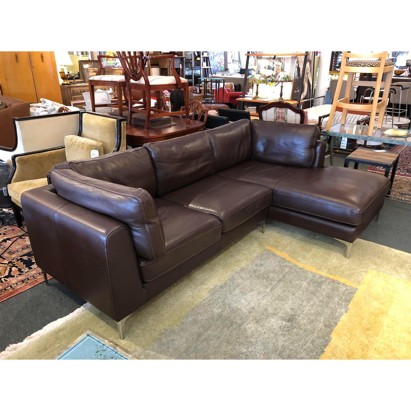 Design Plus Gallery presents a two-piece Nicoletti Sectional from Design Within Reach. Designed by Giuseppe Nicoletti. Upholstered in an Italian chocolate leather. The support cushions have velcro and zipper attachments to keep them in place and