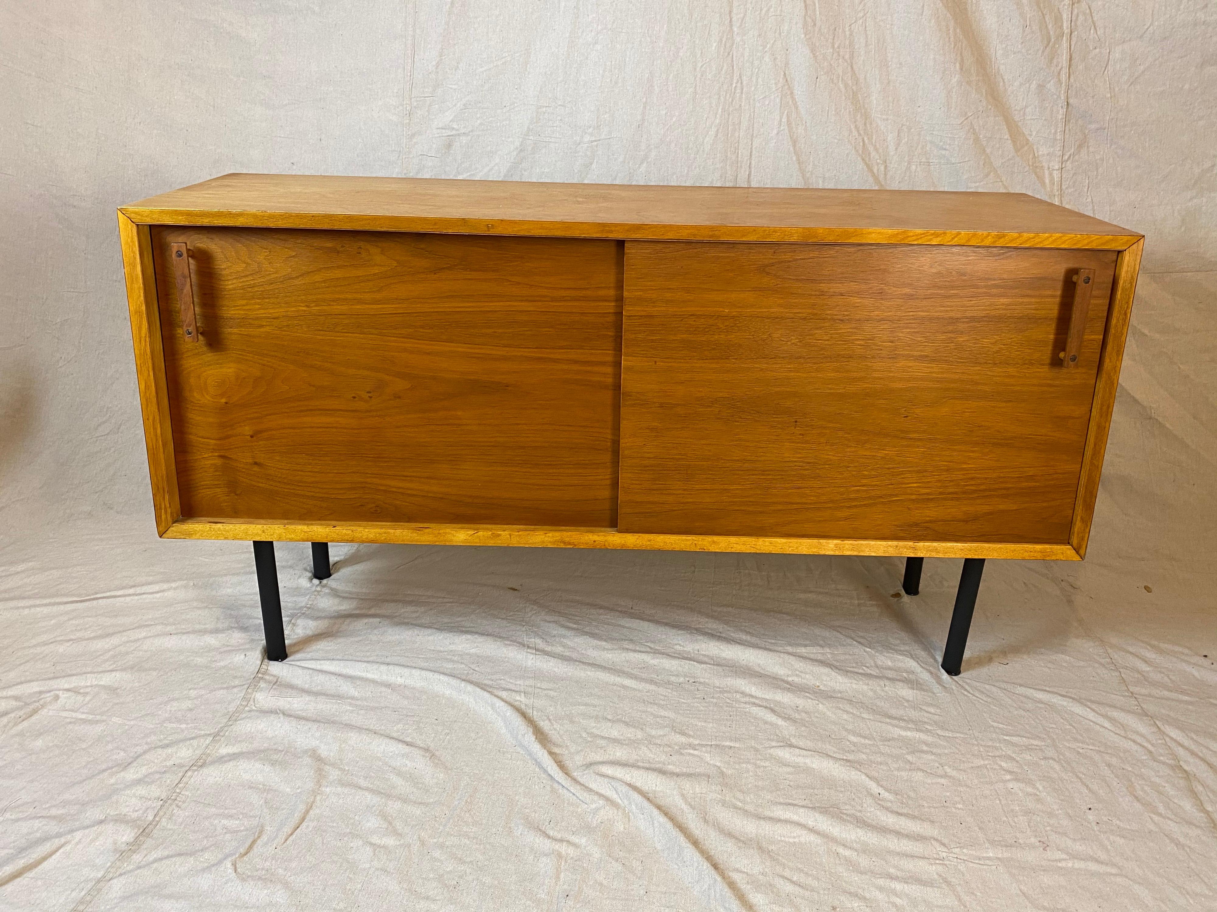 DesignCraft 2-tone credenza with angled sides. Front of cabinet has a slight angle with gives the cabinet a visual twist! Bottom is 15.75 deep and top depth is 14.5. Outside of cabinet is birch and sliding doors are walnut. Doors open to reveal