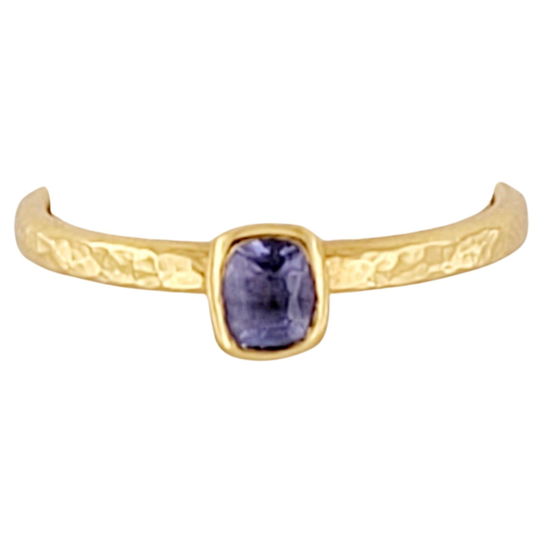 The Ring is Designed by a famous Turkish Designer Gurhan. The Ring is set in 22K Yellow Gold with a beautiful Tanzanite Gemstone. It weights 3.00 grams. Set in Size 6.5. Used, in great condition.