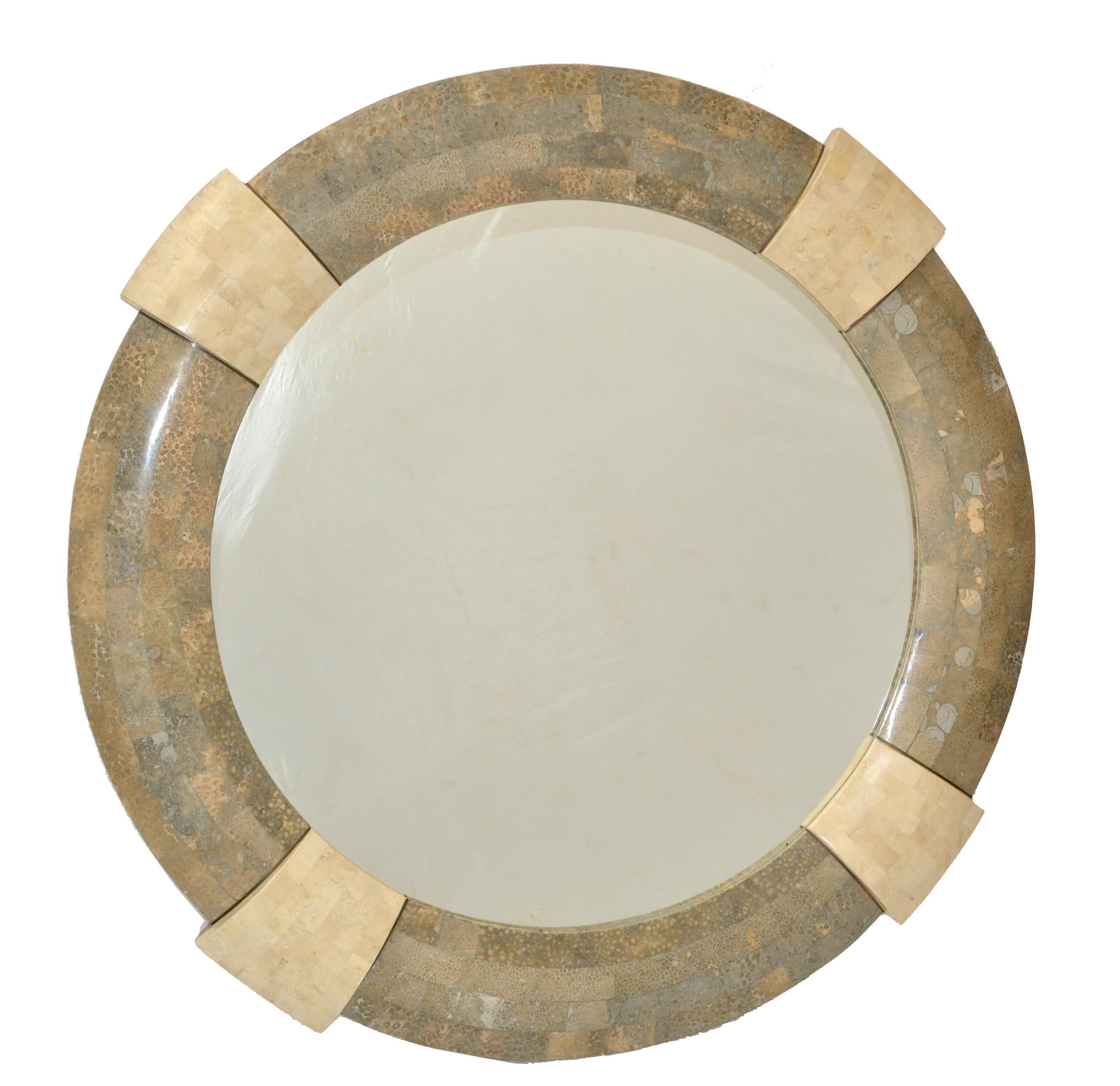 Handcrafted round tessellated mirror with beige and taupe color stone crossbands.
Designed by Robert Marcius for Maitland Smith in America in the 1980.
Mid-Century Modern Design for any interior Style.
Mirror glass dimension: 29.5 inches.
 