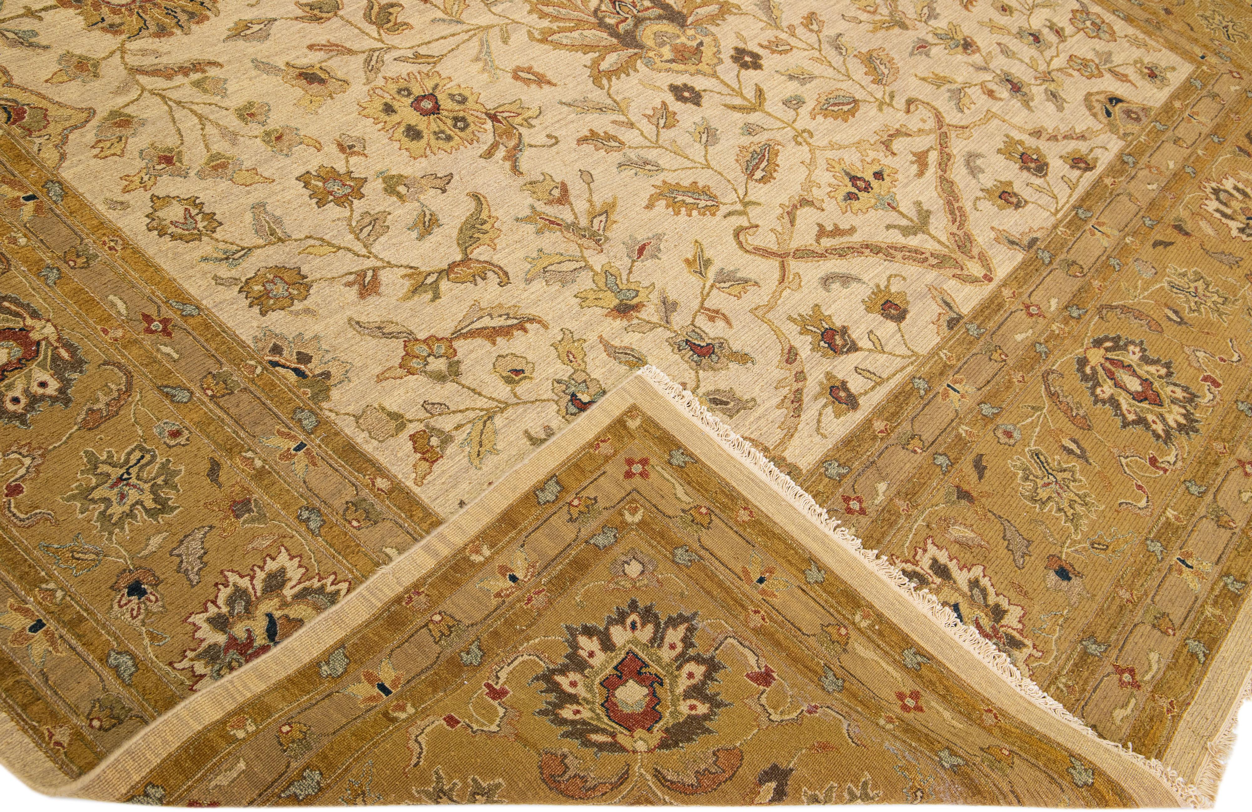 Beautiful Paki Peshawar hand-knotted wool rug with a beige color field. This modern rug has a brown designed frame with multicolor accents in an all-over Classic vine scroll and a palmettes motif.

This rug measures: 12' x 14'10