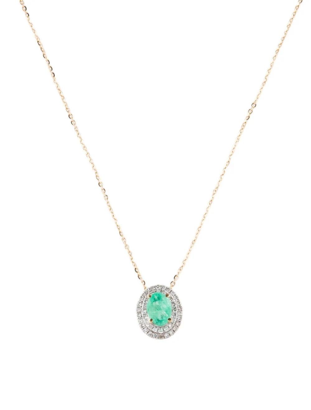 Immerse yourself in the timeless elegance of our 14K Yellow Gold Emerald & Diamond Pendant Necklace. This exquisite piece features a captivating Oval Modified Brilliant Emerald, complemented by shimmering diamonds.

Specifications:

* Length: 16