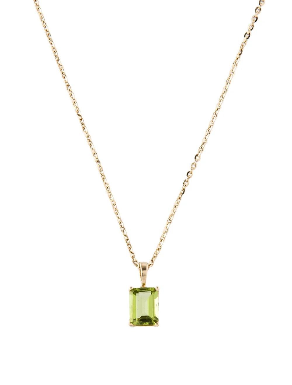 Indulge in the timeless elegance of our 14K Yellow Gold Peridot Pendant Necklace, featuring a dazzling 1.47 Carat Cut Cornered Rectangular Step Cut Peridot. Crafted with exquisite attention to detail, this necklace is a stunning addition to any